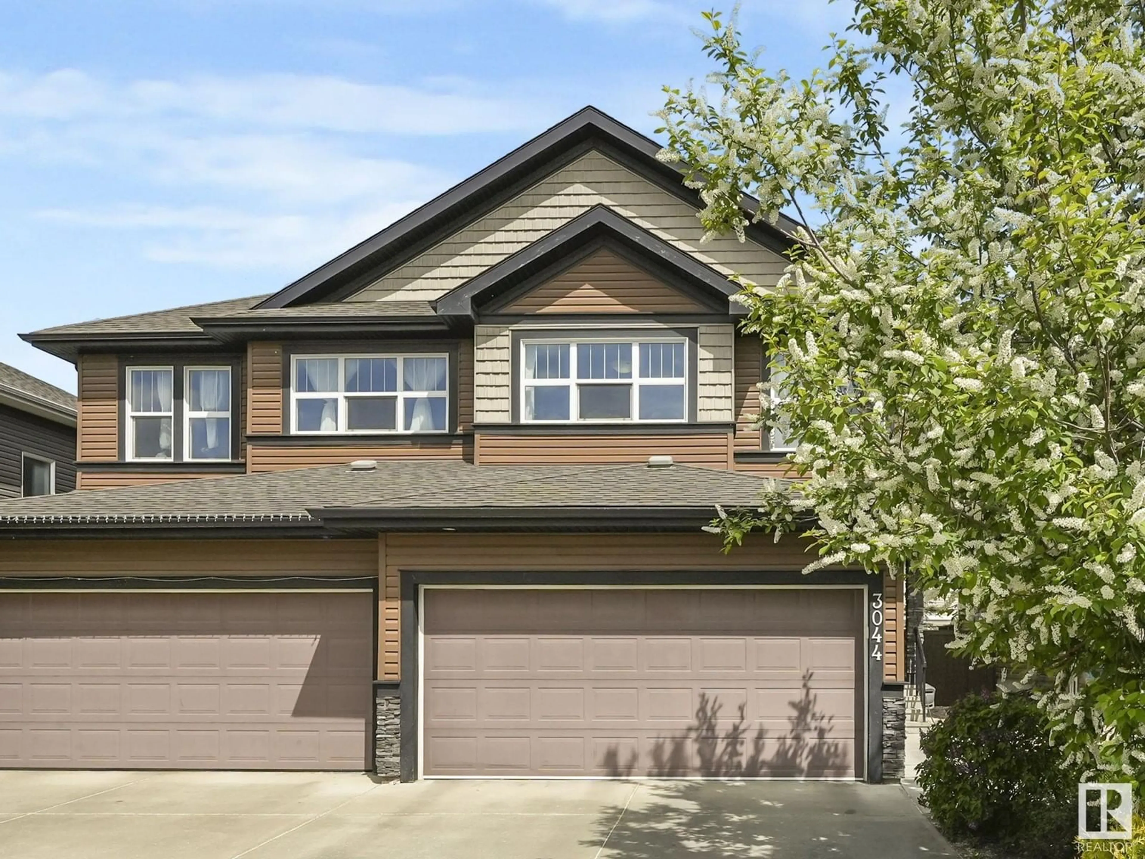 Home with vinyl exterior material, street for 3044 HARVEY CR, Edmonton Alberta T6M0N2
