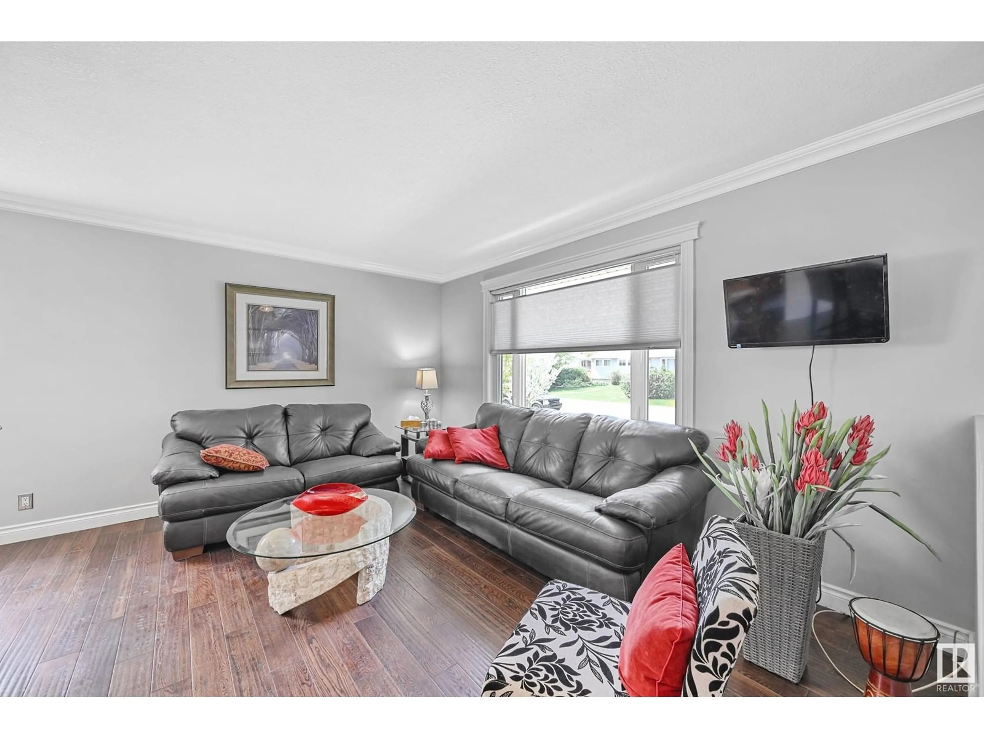 Living room with furniture, wood/laminate floor for NW - 8915 148 ST, Edmonton Alberta T5R0Z8