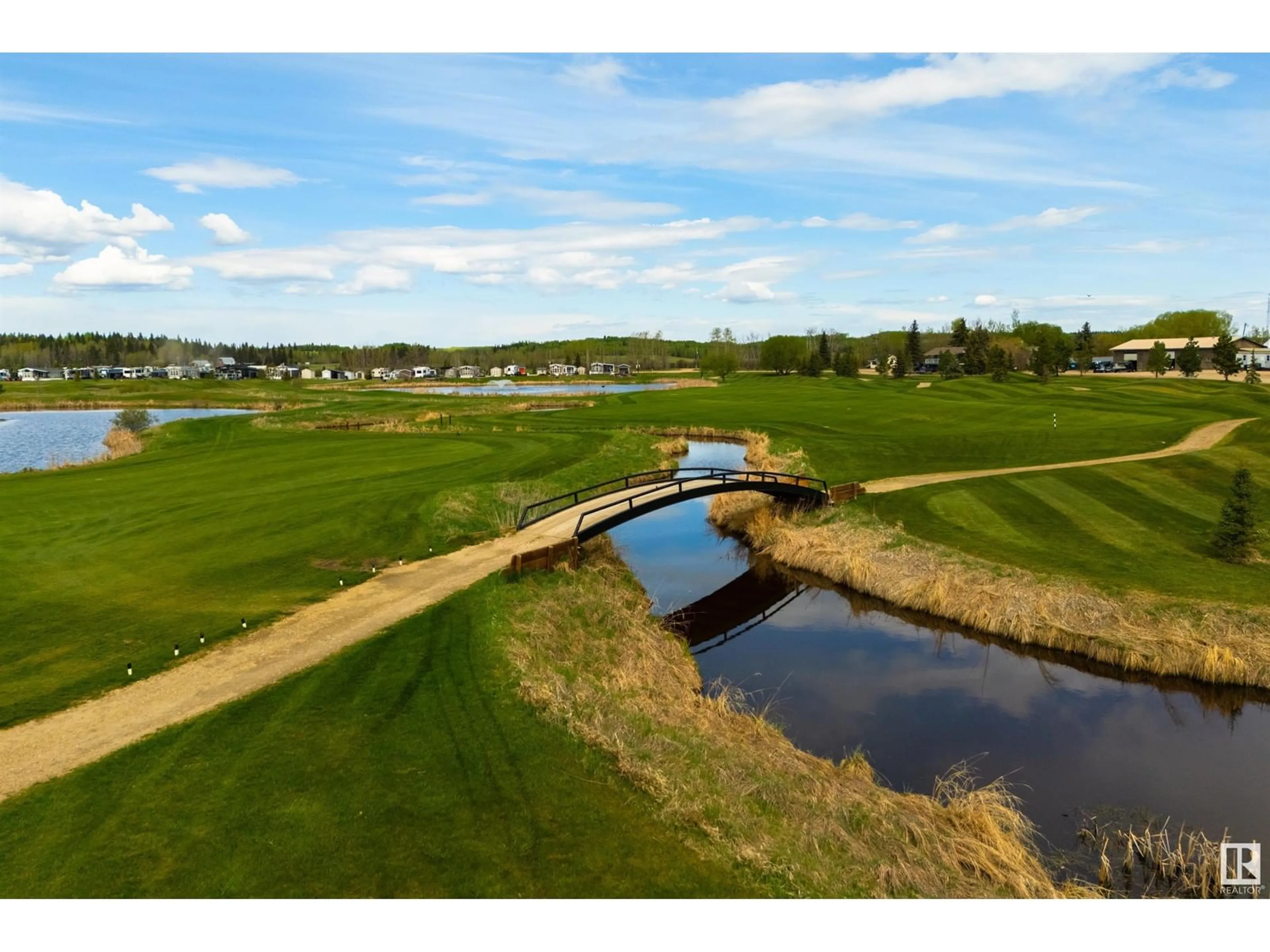 A pic from outside/outdoor area/front of a property/back of a property/a pic from drone, water/lake/river/ocean view for 53126 - 216 RGE ROAD 70, Rural Parkland County Alberta T0E0W0