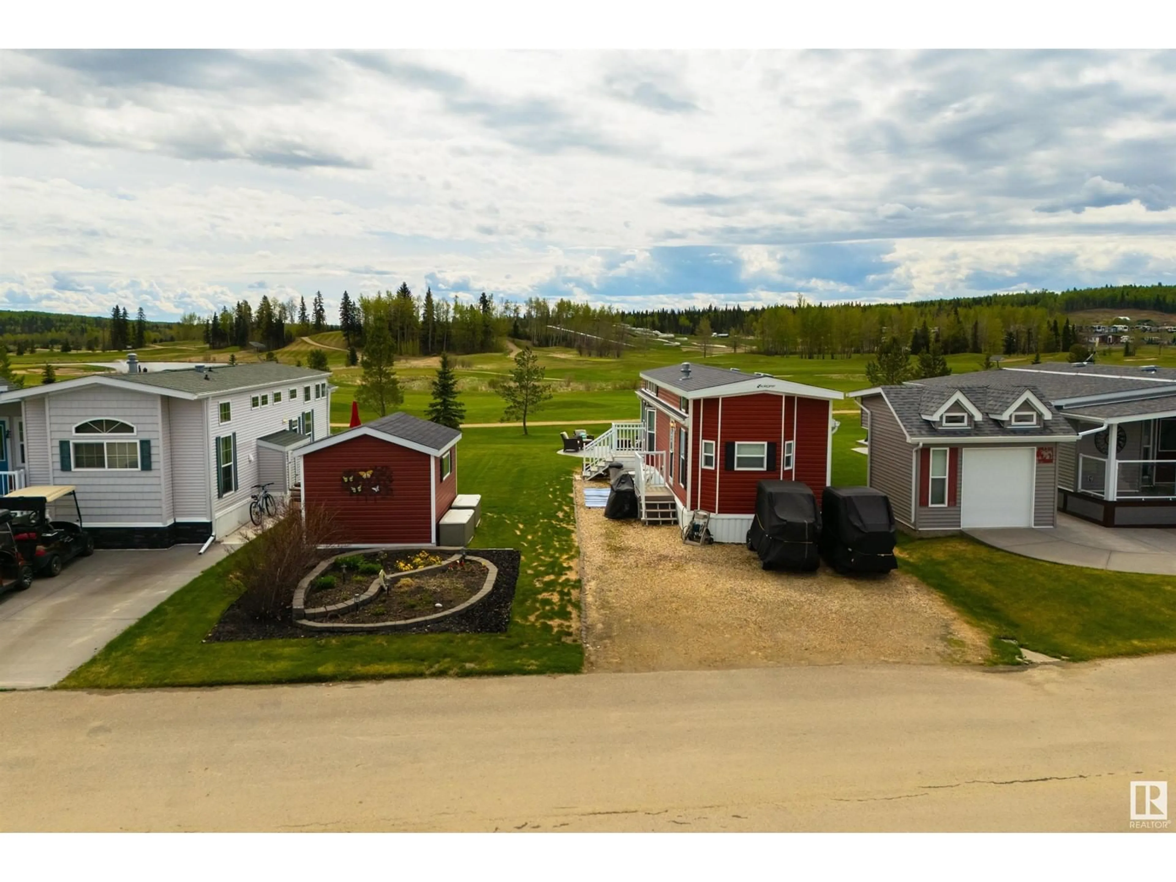 A pic from outside/outdoor area/front of a property/back of a property/a pic from drone, street for 53126 - 216 RGE ROAD 70, Rural Parkland County Alberta T0E0W0