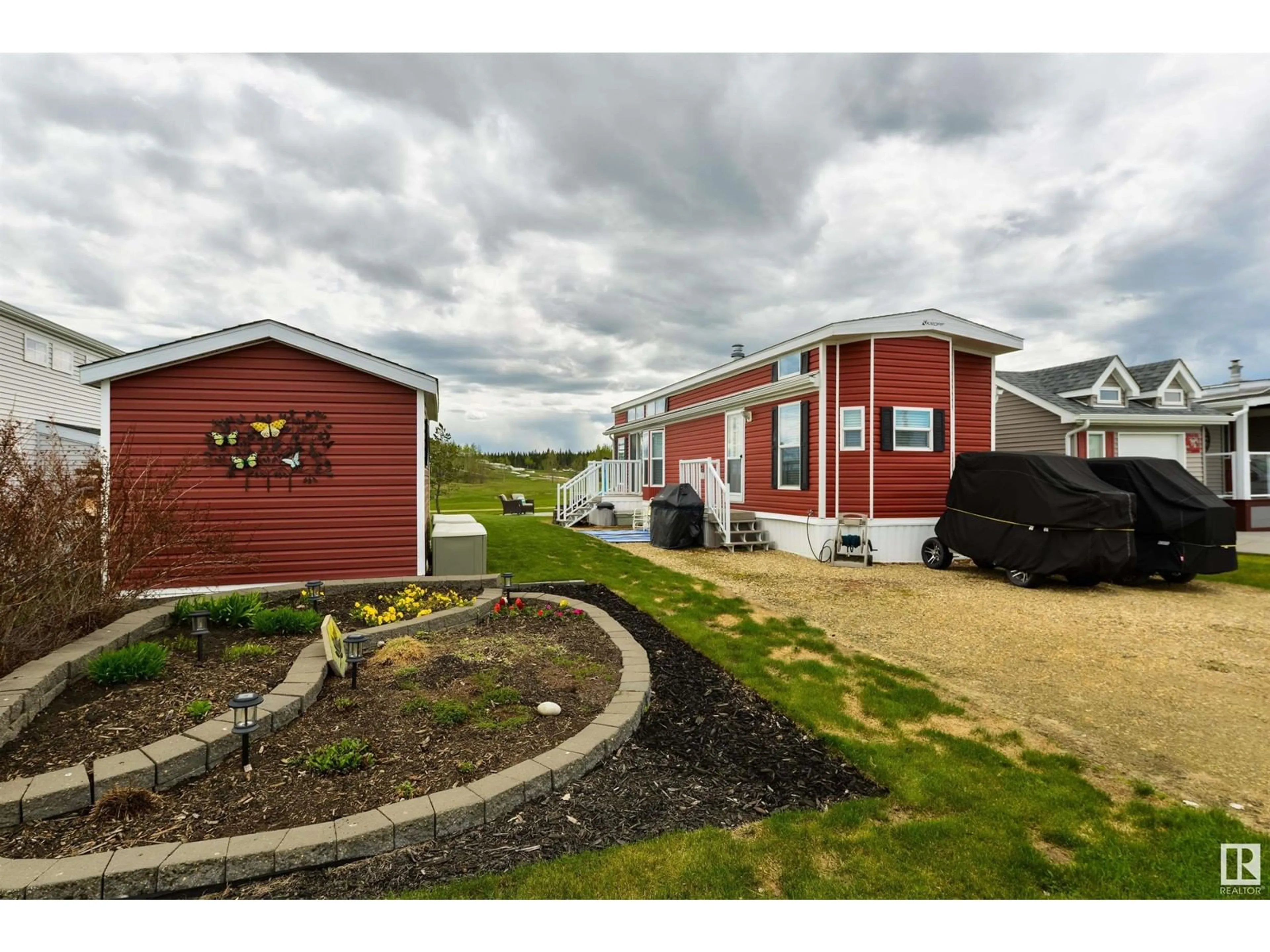 A pic from outside/outdoor area/front of a property/back of a property/a pic from drone, water/lake/river/ocean view for 53126 - 216 RGE ROAD 70, Rural Parkland County Alberta T0E0W0
