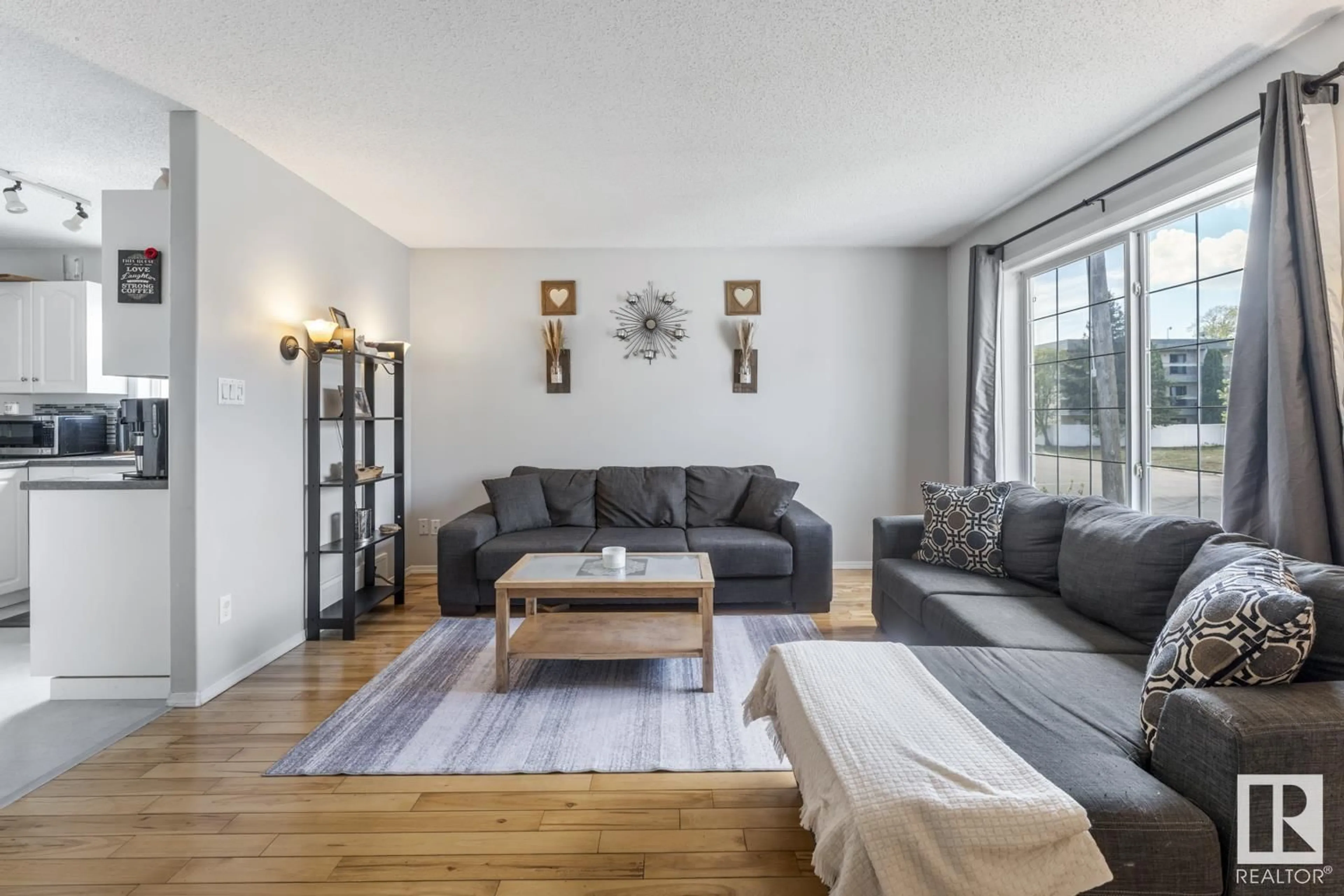 Living room with furniture, wood/laminate floor for 4910 51 AV, Cold Lake Alberta T9M1X2