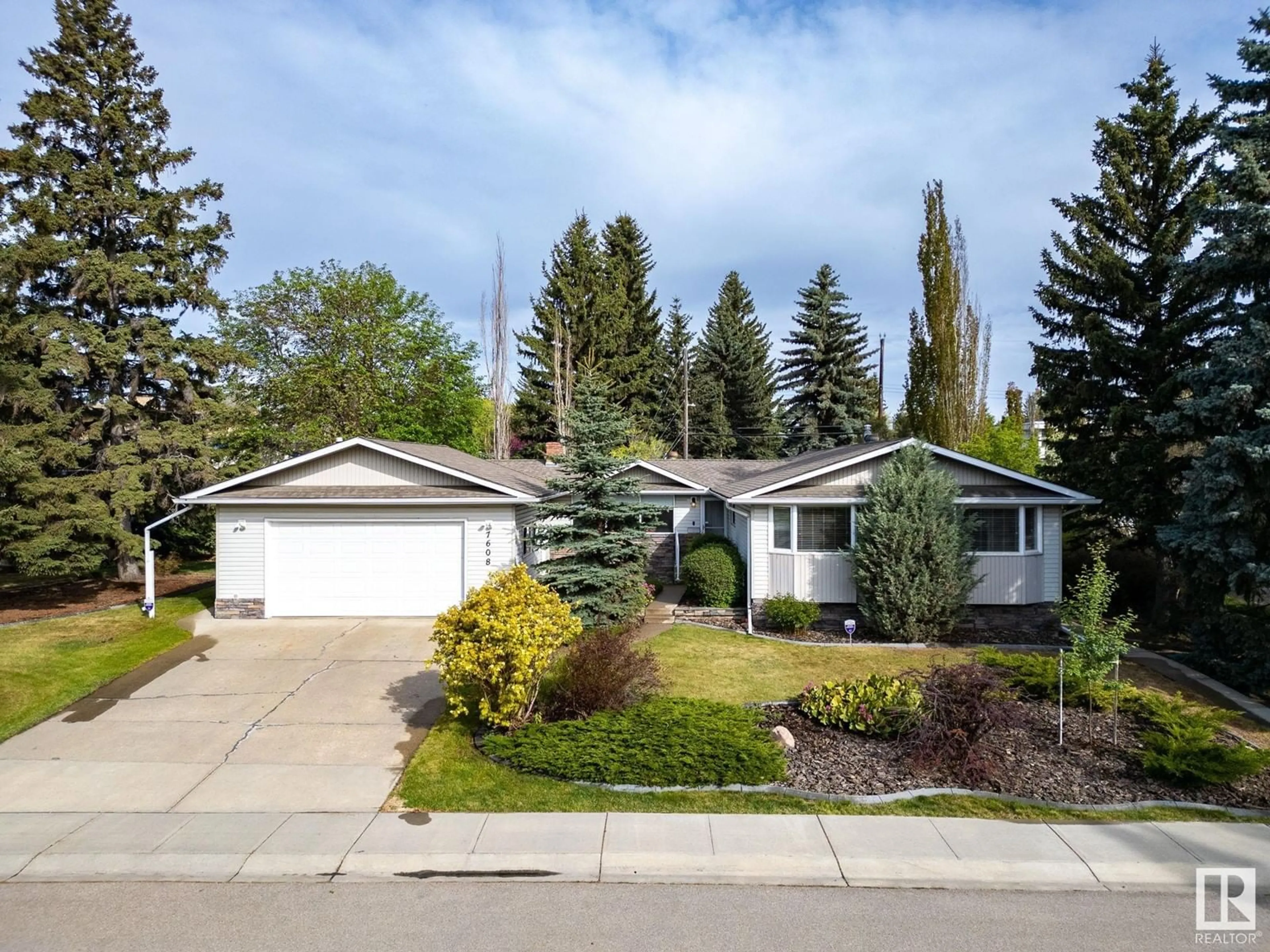Home with vinyl exterior material, street for NW - 7608 143A ST, Edmonton Alberta T5R0P9