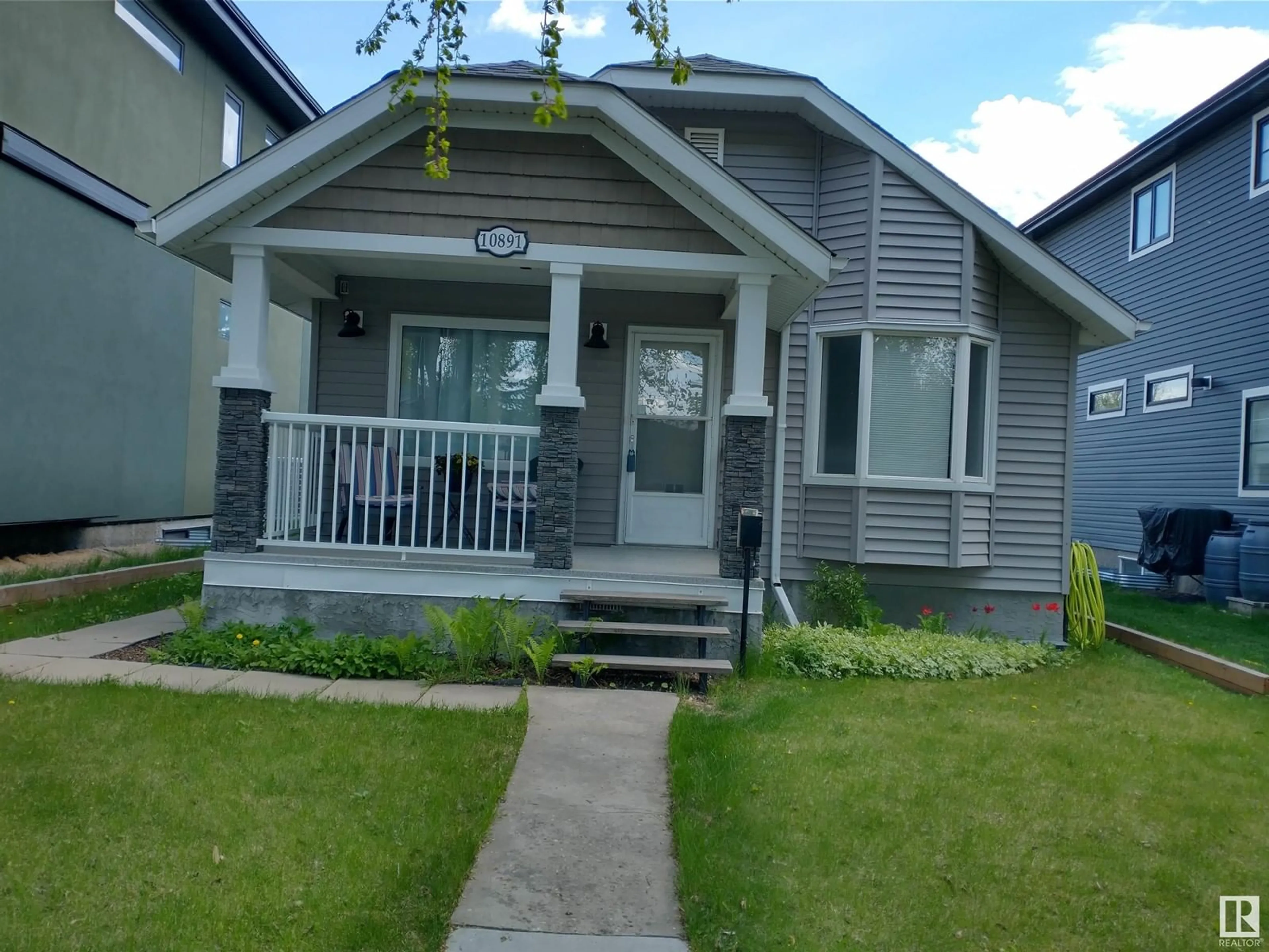 Home with vinyl exterior material, street for 10891 74 ST, Edmonton Alberta T5B2A1