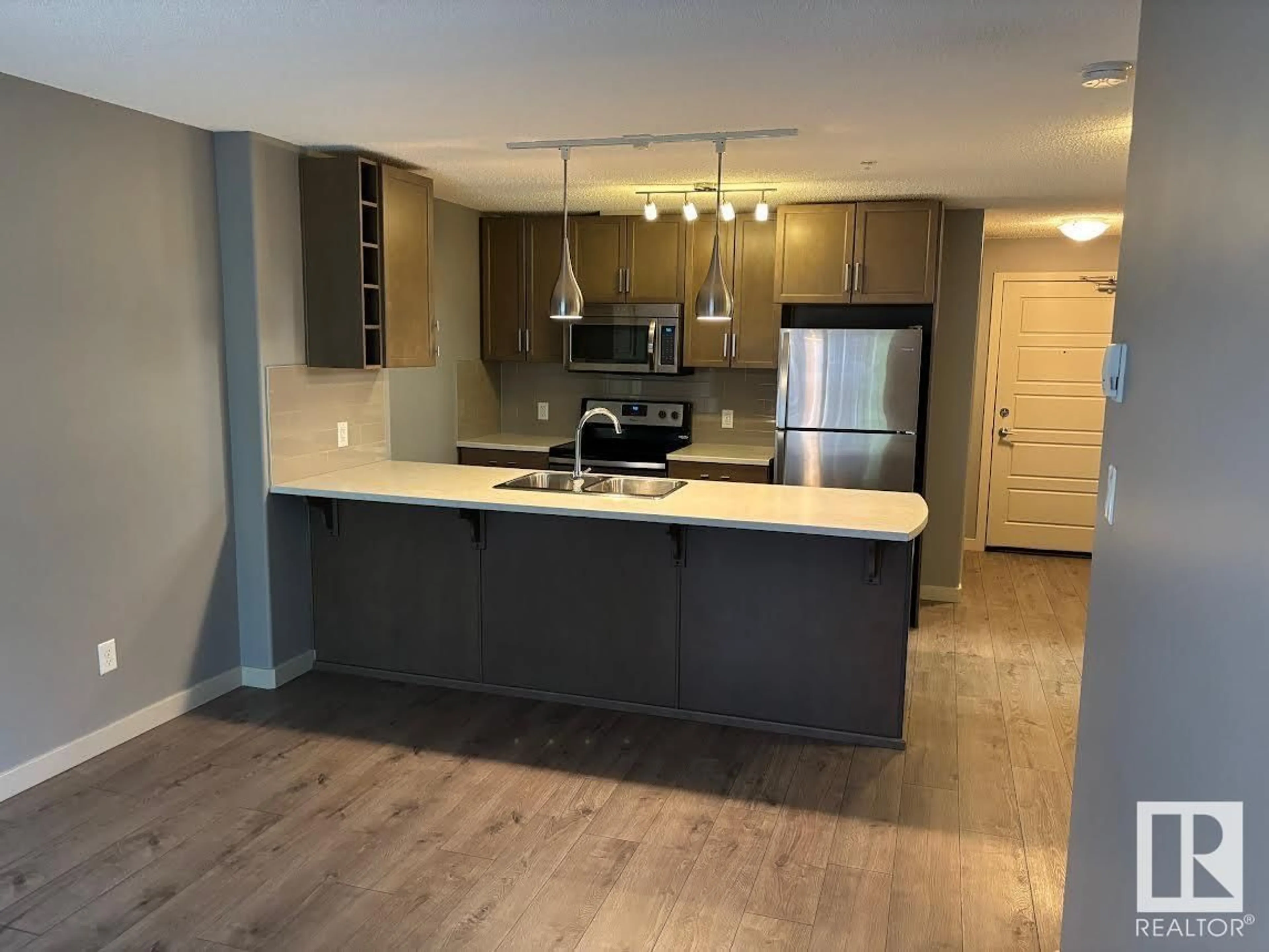 Open concept kitchen, unknown for 317 - 5510 SCHONSEE DR, Edmonton Alberta T5Z0N9