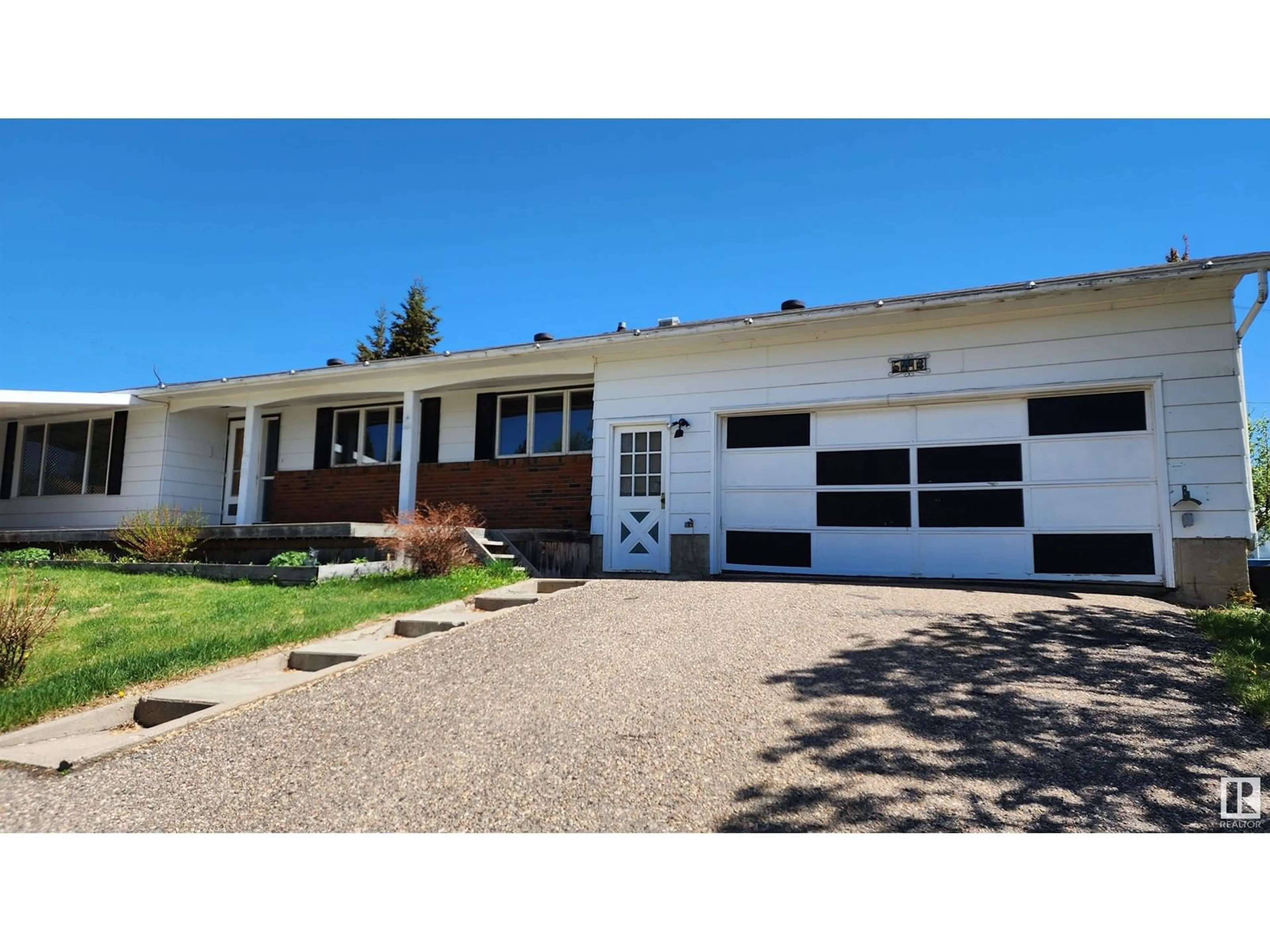 Home with vinyl exterior material, street for 5413 50 ST, Elk Point Alberta T0A1A0