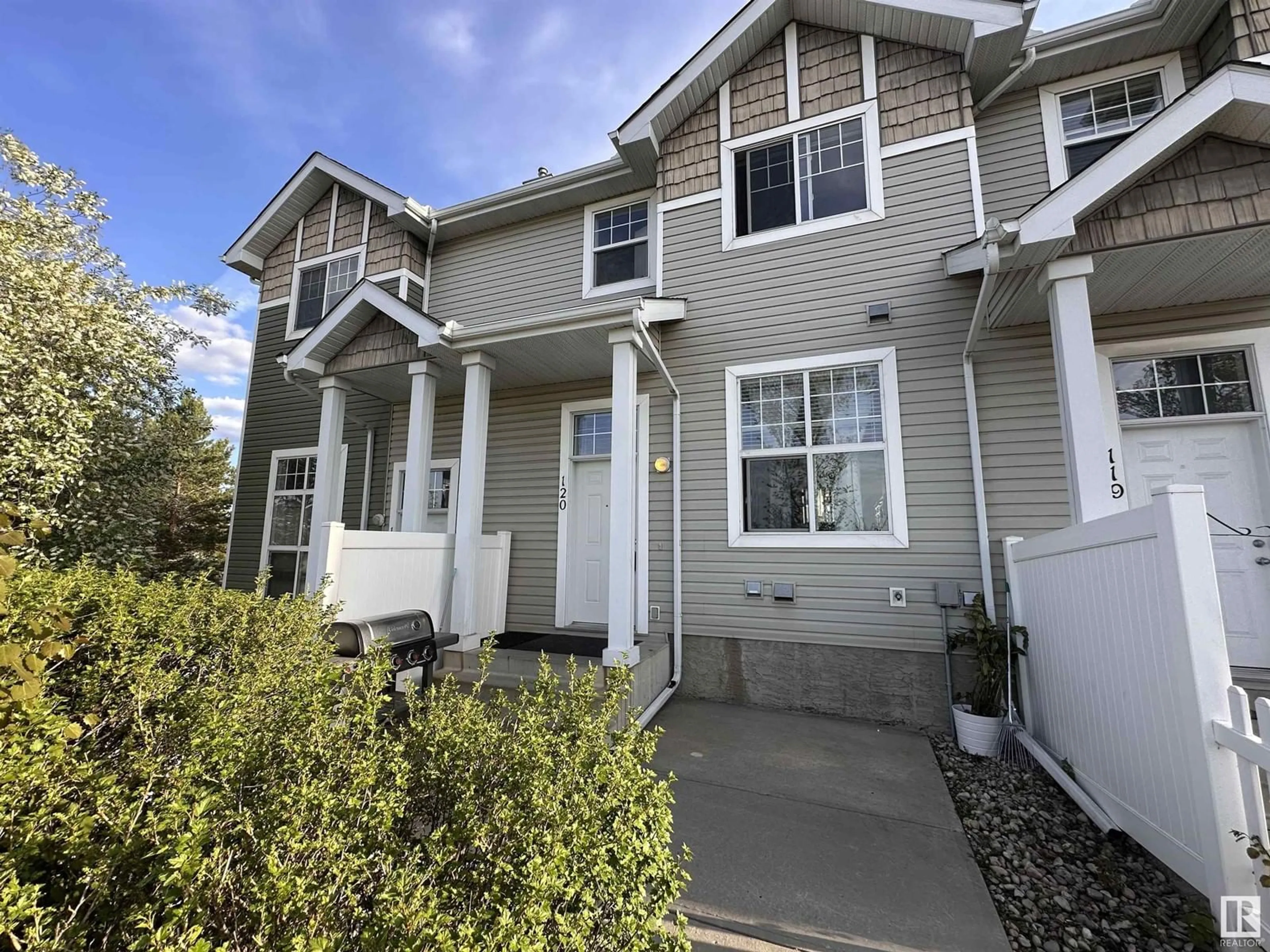 Home with vinyl exterior material, street for 120 5604 199 ST NW, Edmonton Alberta T6M2Z9