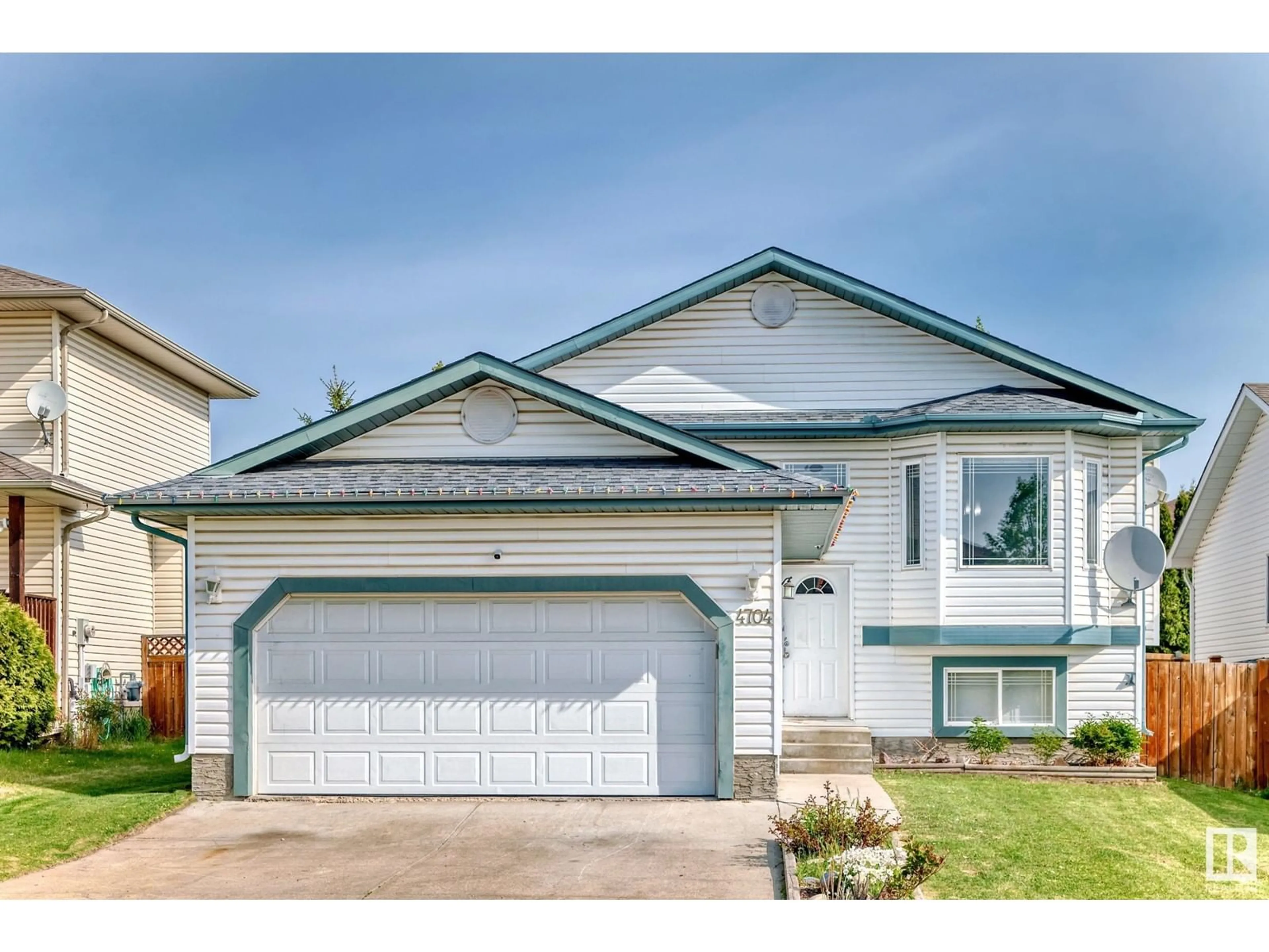 Home with vinyl exterior material, street for 4704 151 AV, Edmonton Alberta T5Y3A2