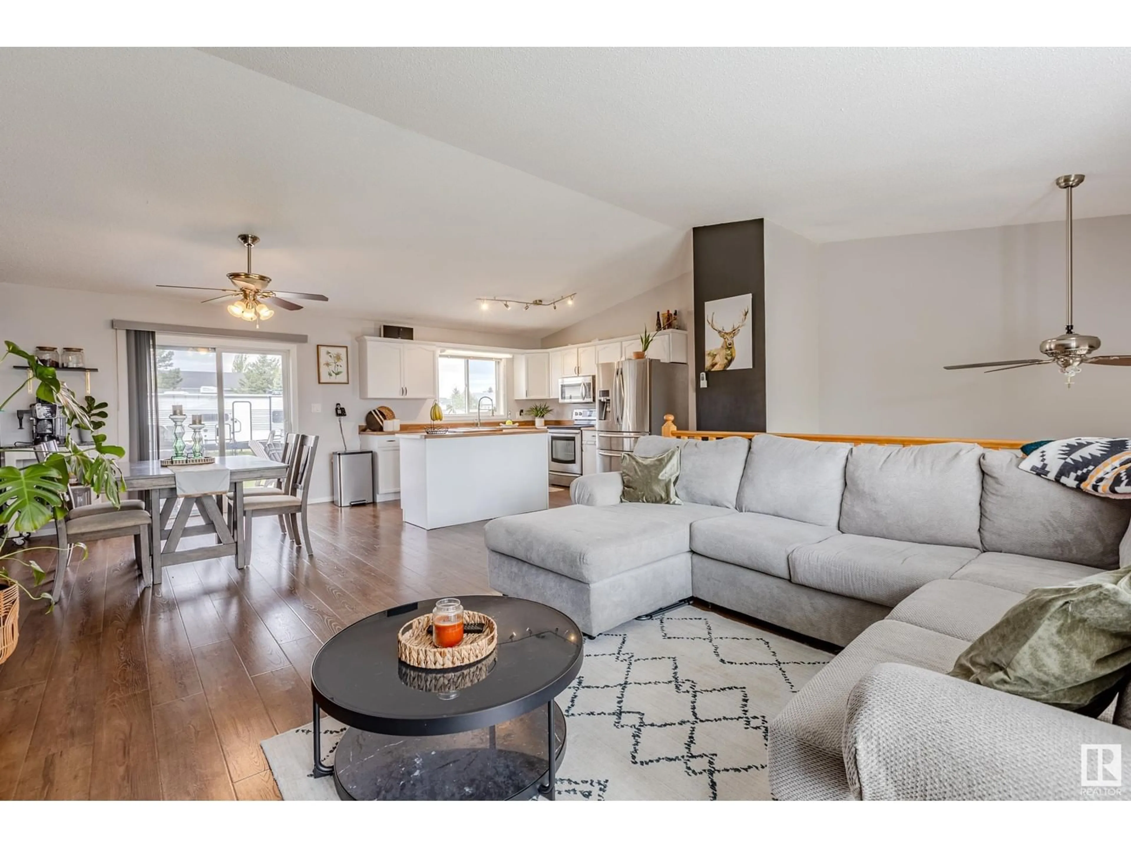 Living room with furniture, wood/laminate floor for 5122 51 ST, Legal Alberta T0G1L0
