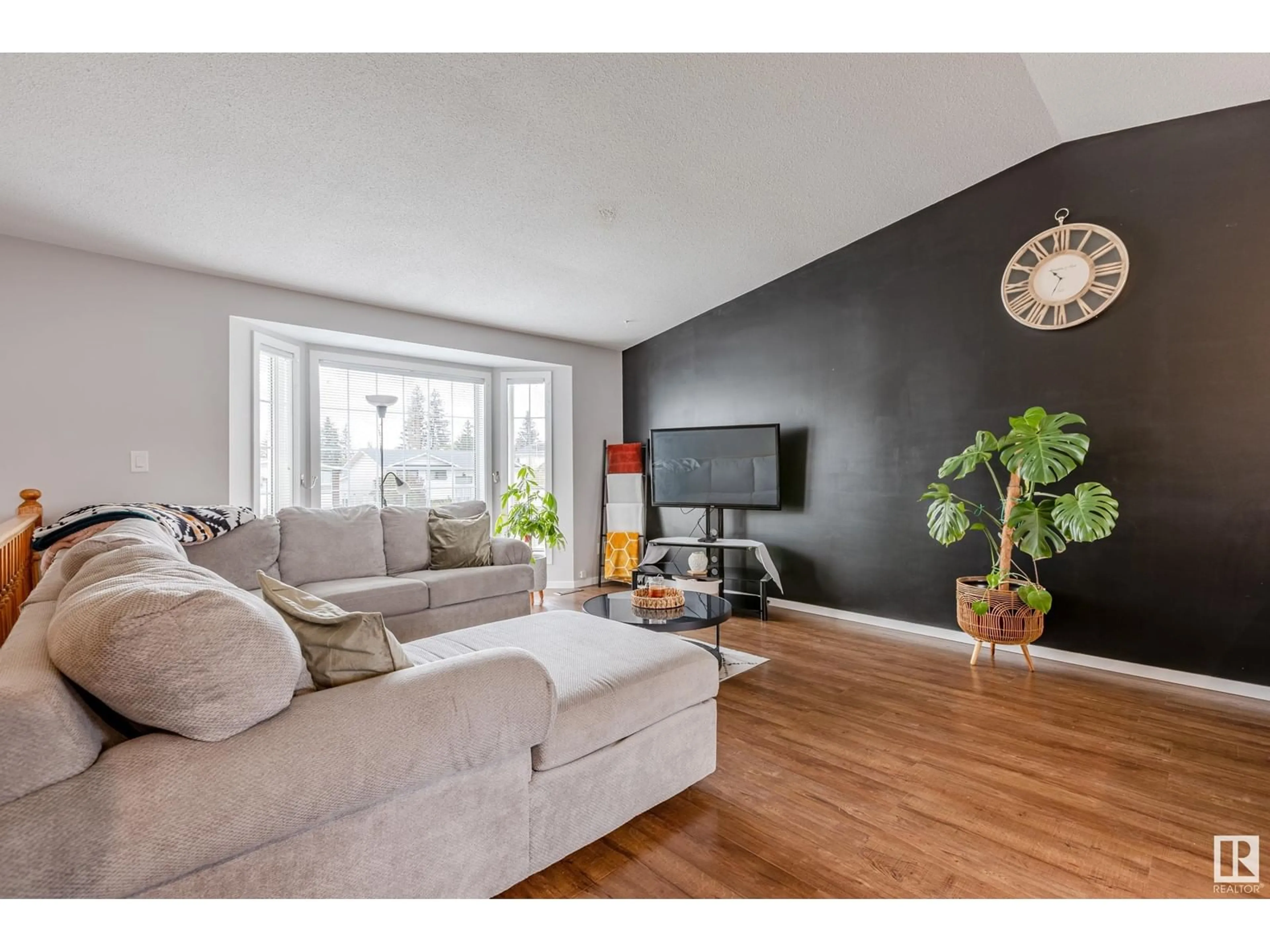 Living room with furniture, wood/laminate floor for 5122 51 ST, Legal Alberta T0G1L0