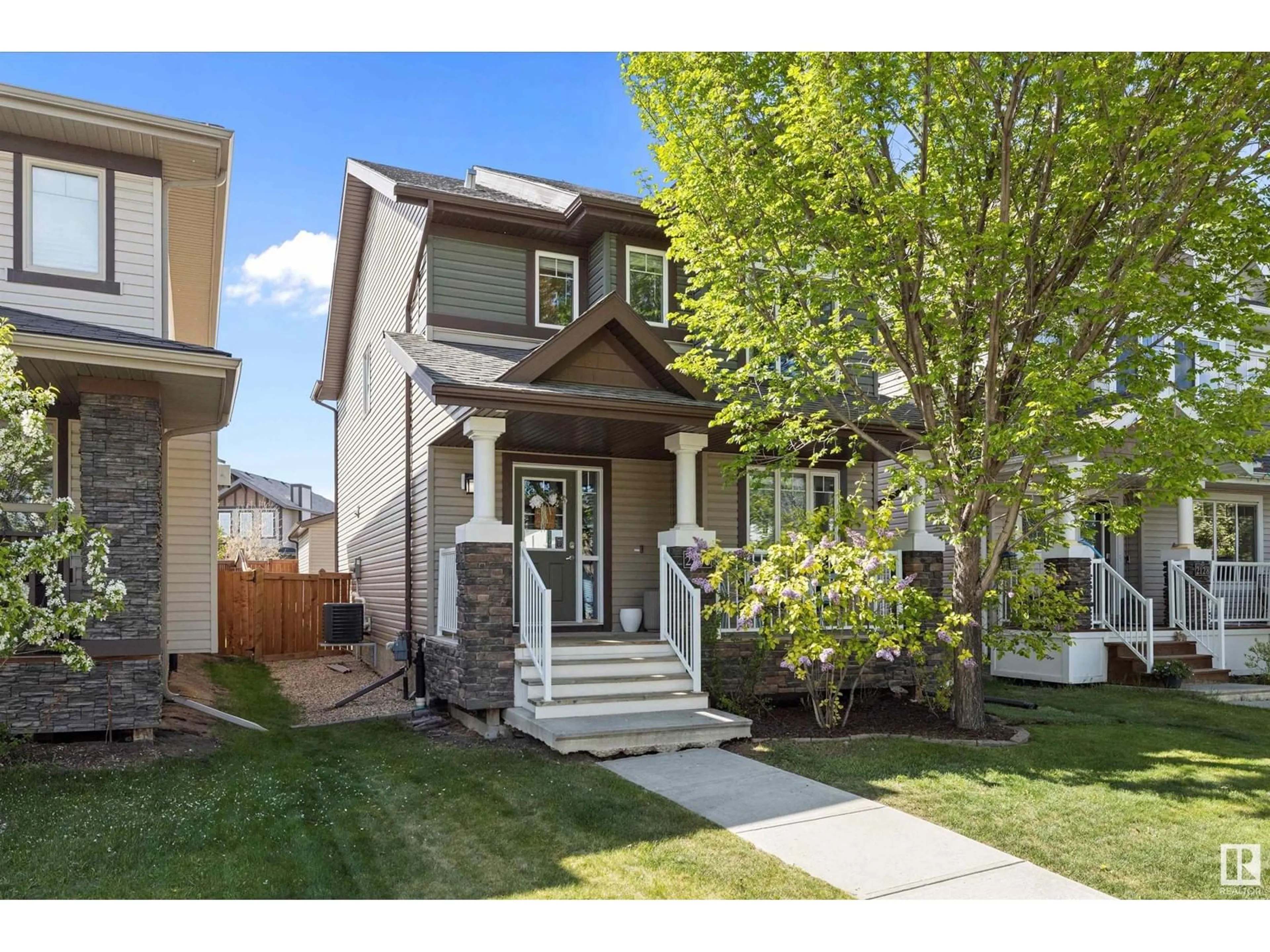 Home with vinyl exterior material, street for 2130 GLENRIDDING WY, Edmonton Alberta T6W2H4