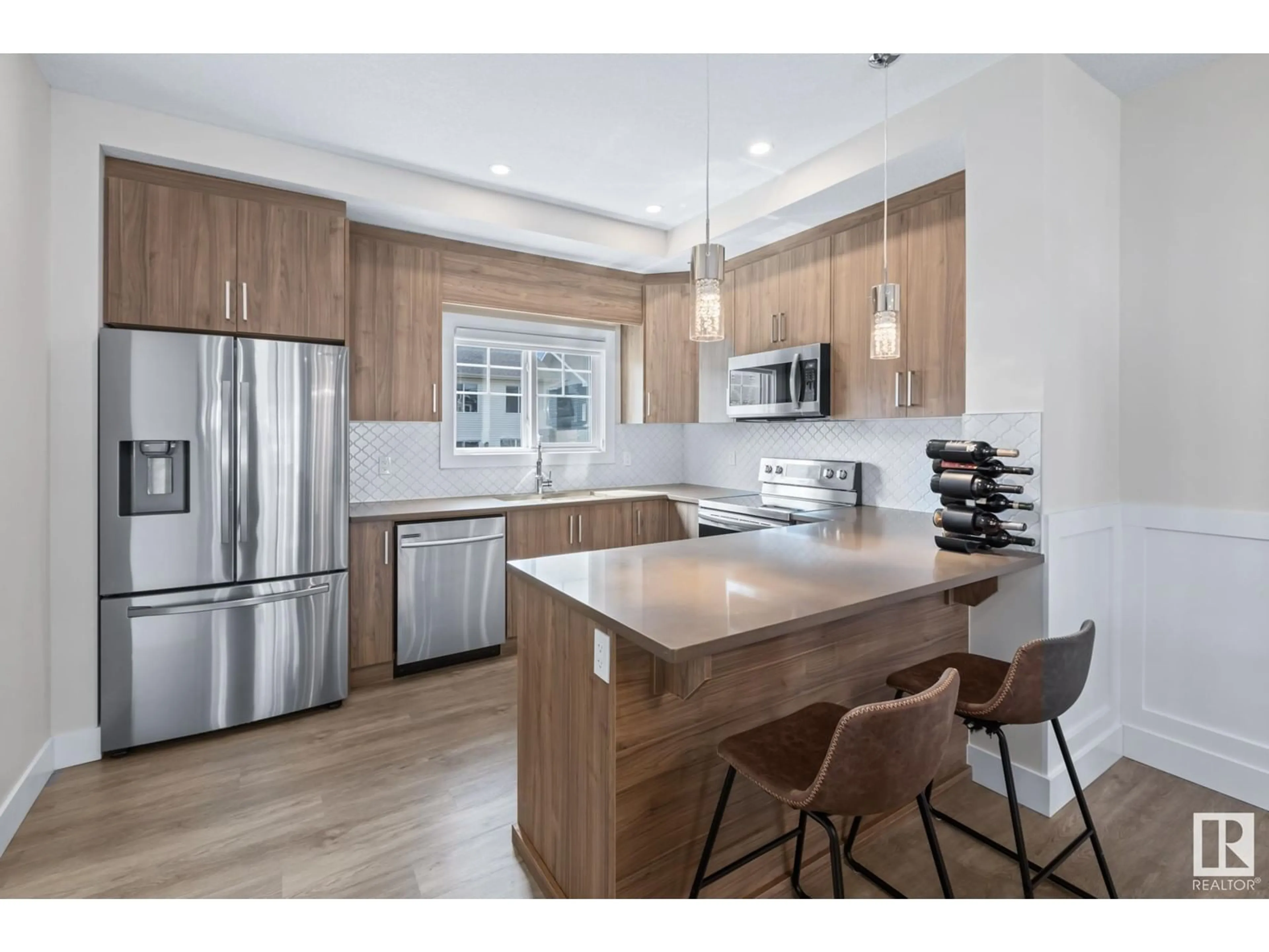 Open concept kitchen, wood/laminate floor for 16 230 EDGEMONT RD NW, Edmonton Alberta T6M0Y8