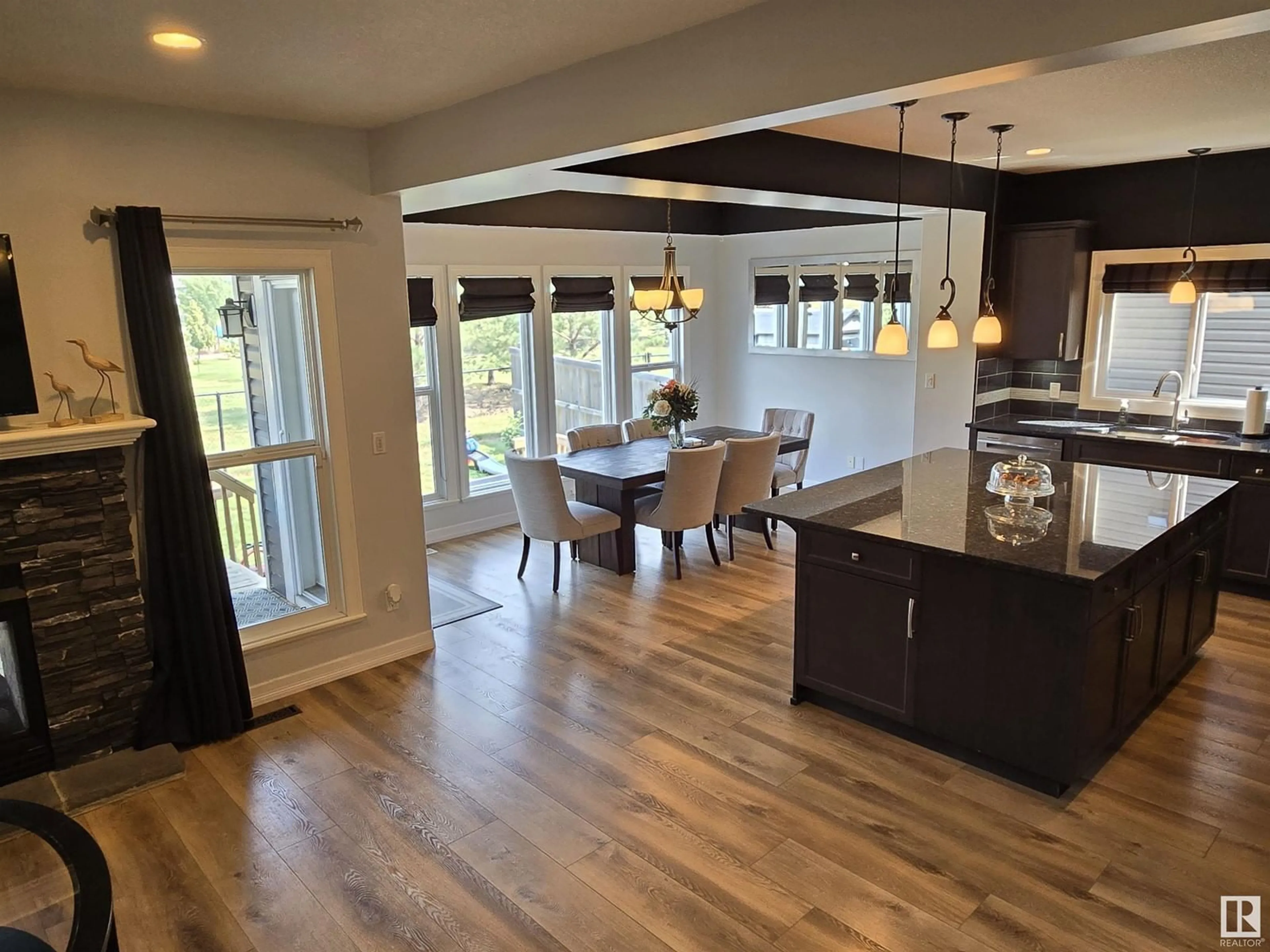 Open concept kitchen, wood/laminate floor for 386 SIMPKINS WD, Leduc Alberta T9E0Y4
