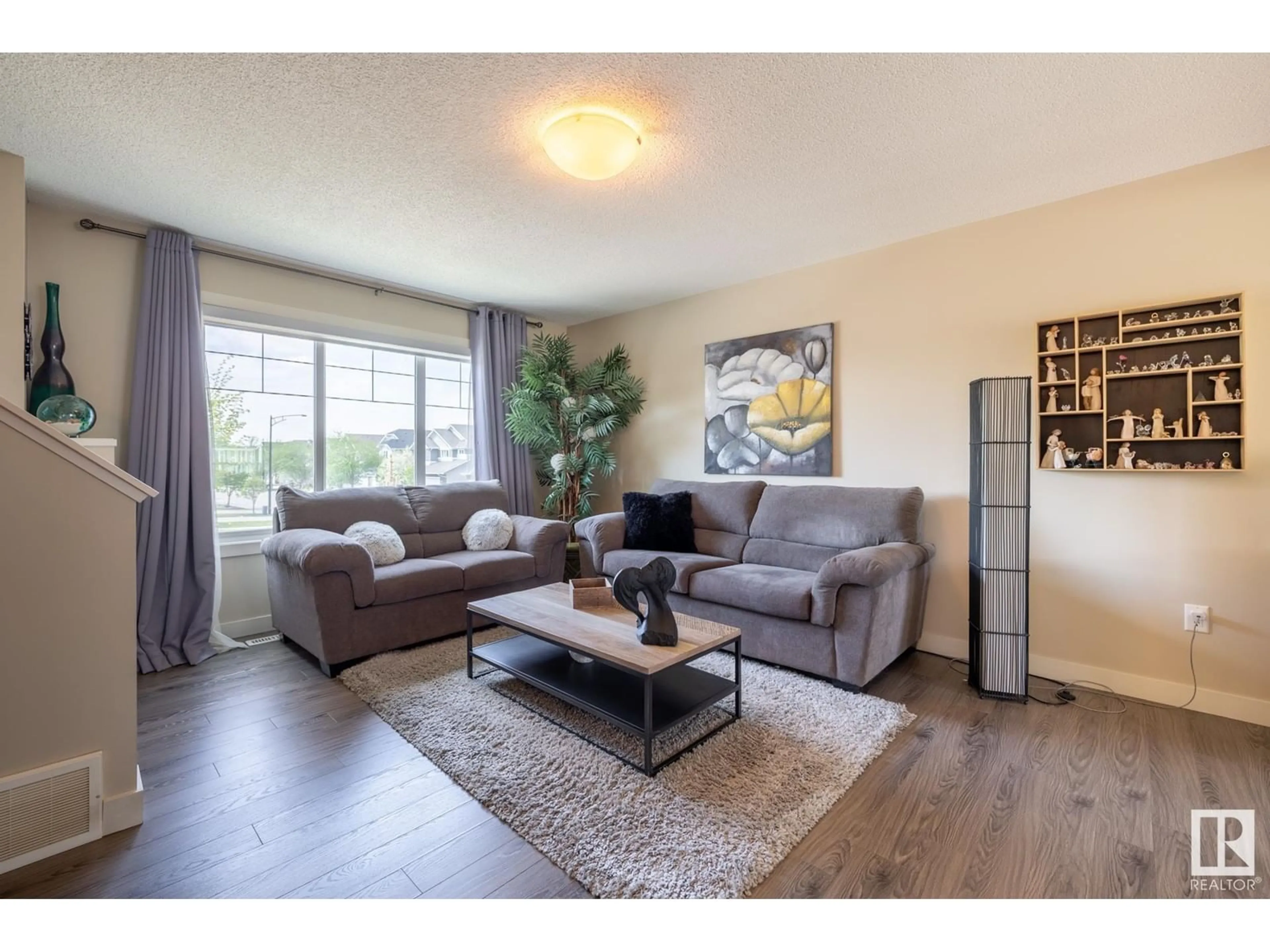 Living room with furniture, wood/laminate floor for #8 - 1391 STARLING DR, Edmonton Alberta T5S0L3