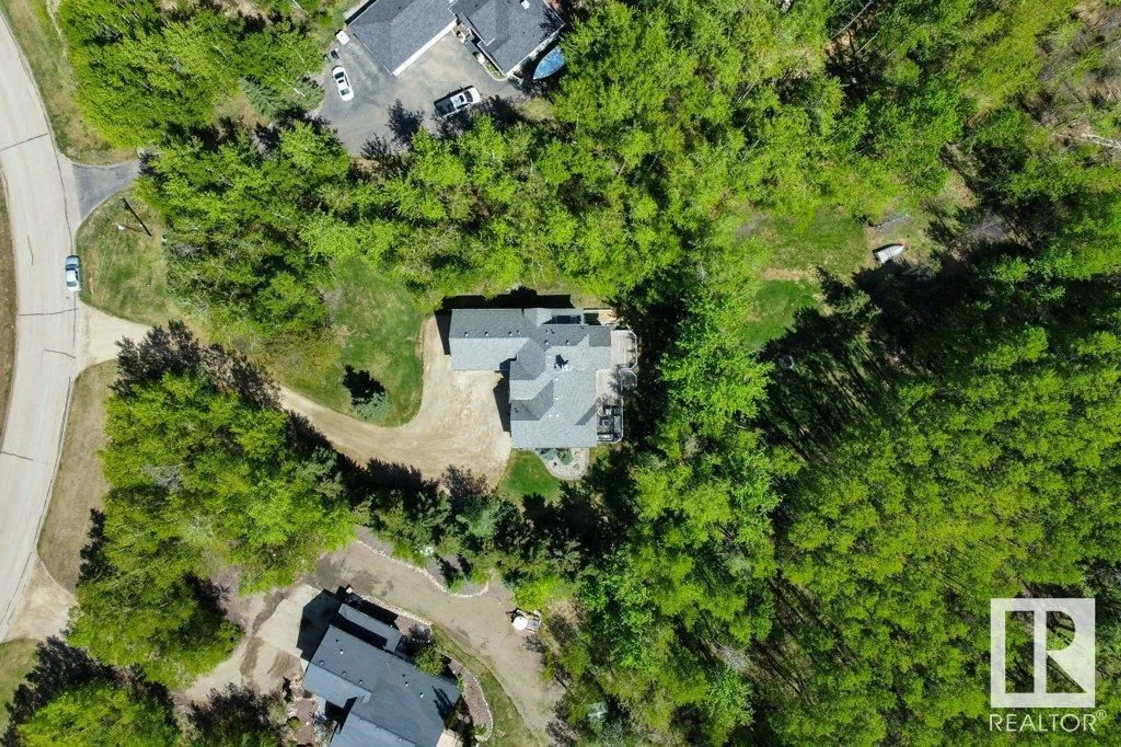 A pic from outside/outdoor area/front of a property/back of a property/a pic from drone, forest/trees view for 181 52465 RGE ROAD 213, Rural Strathcona County Alberta T8G2E8