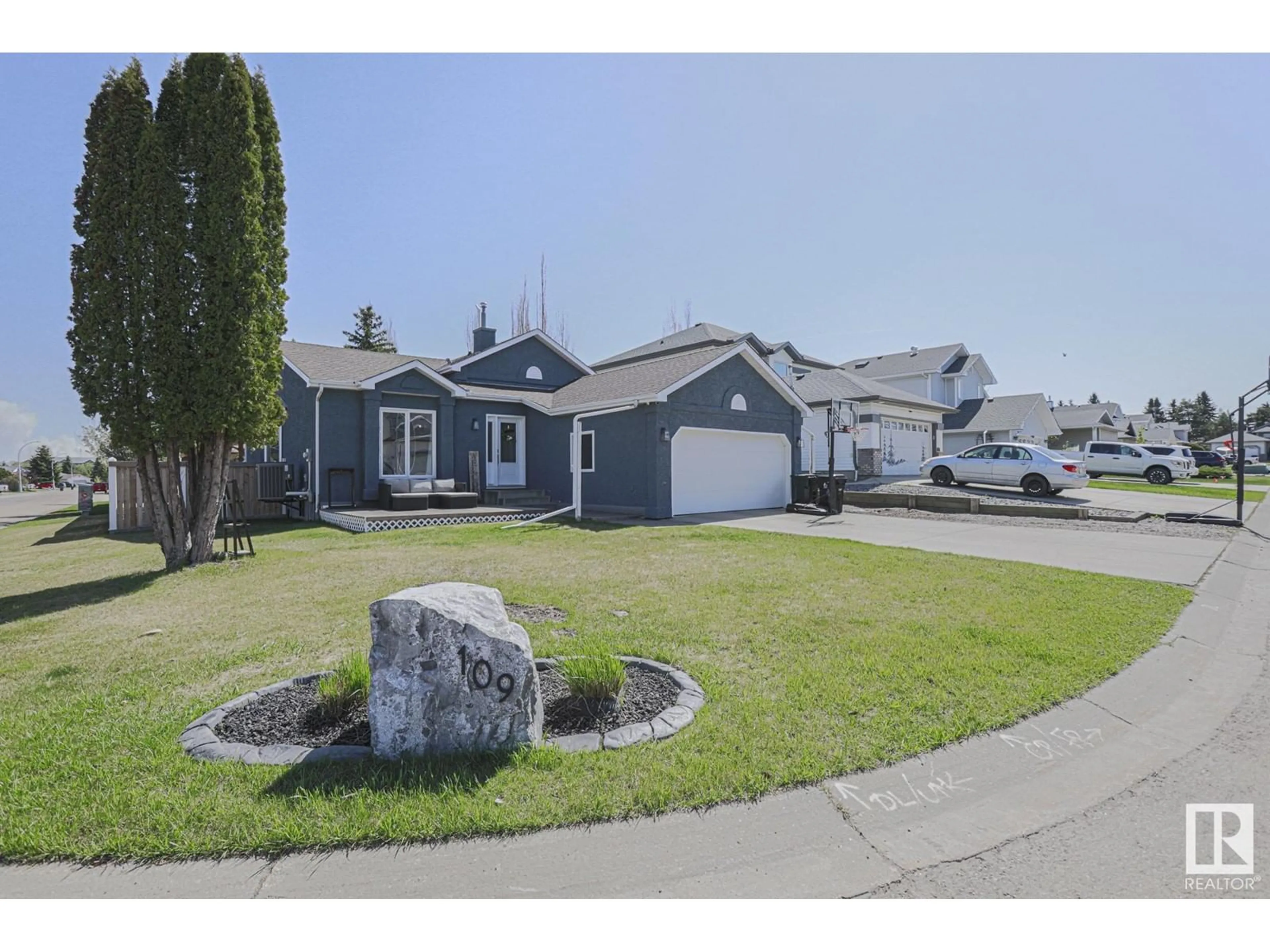 Home with vinyl exterior material, street for 109 WOODSIDE CR, Spruce Grove Alberta T7X3E4