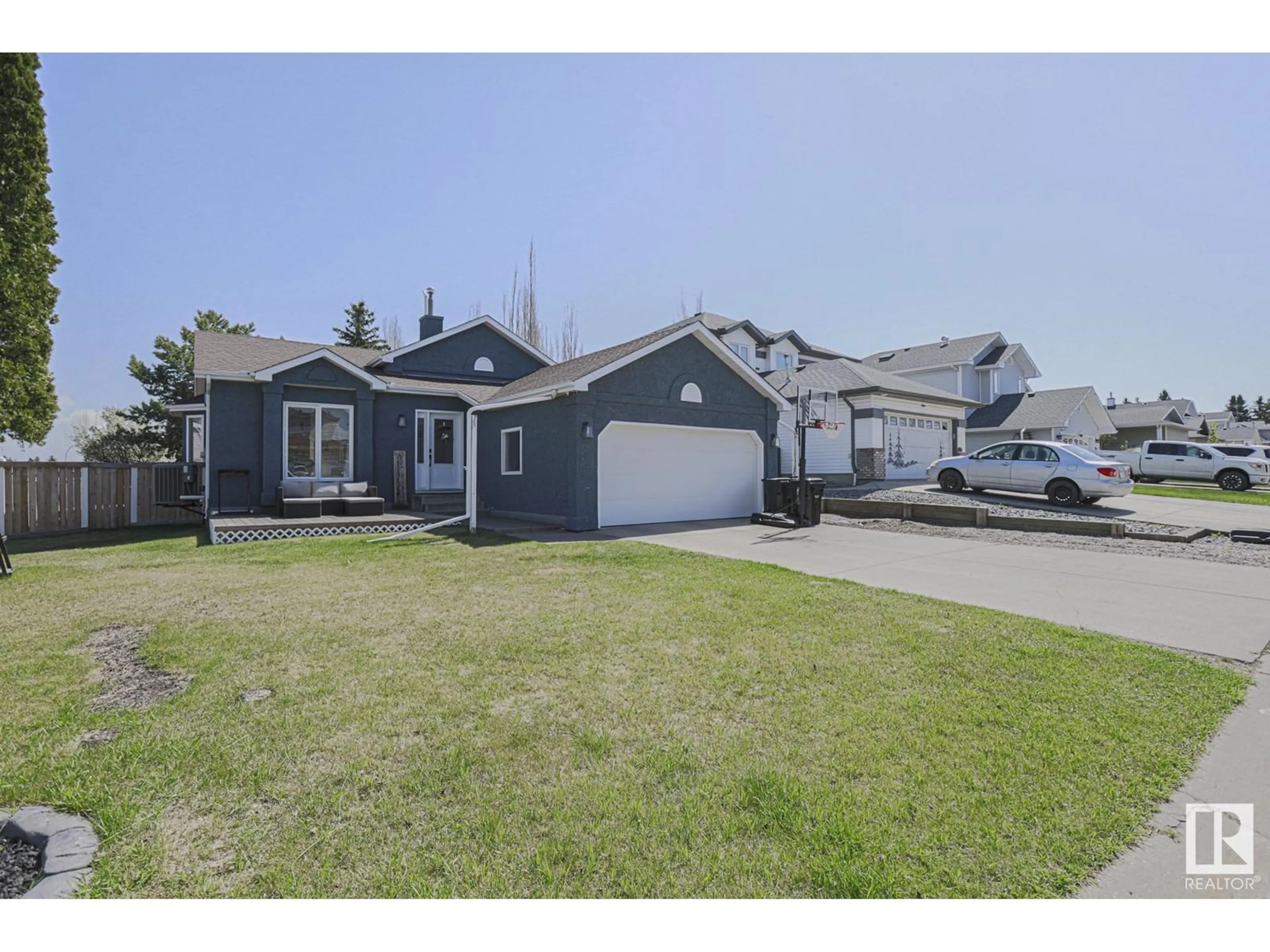 Home with vinyl exterior material, street for 109 WOODSIDE CR, Spruce Grove Alberta T7X3E4