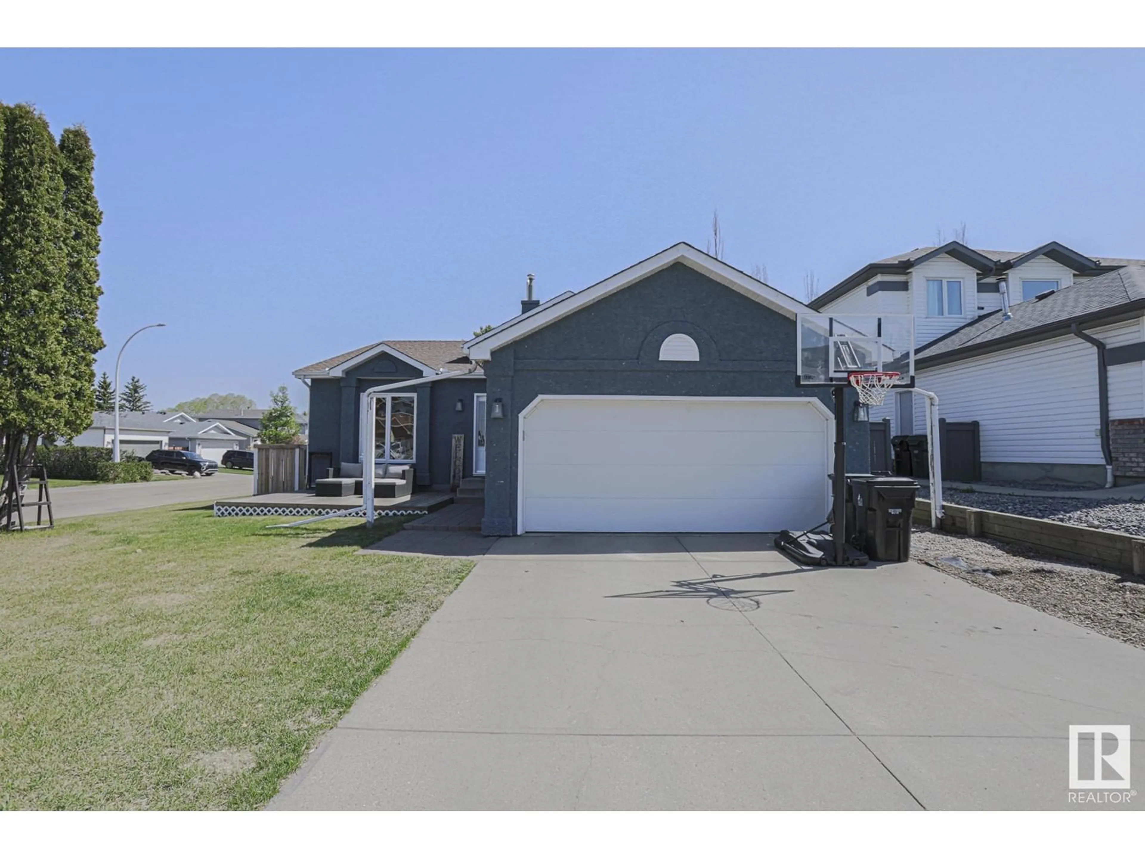 Home with vinyl exterior material, street for 109 WOODSIDE CR, Spruce Grove Alberta T7X3E4
