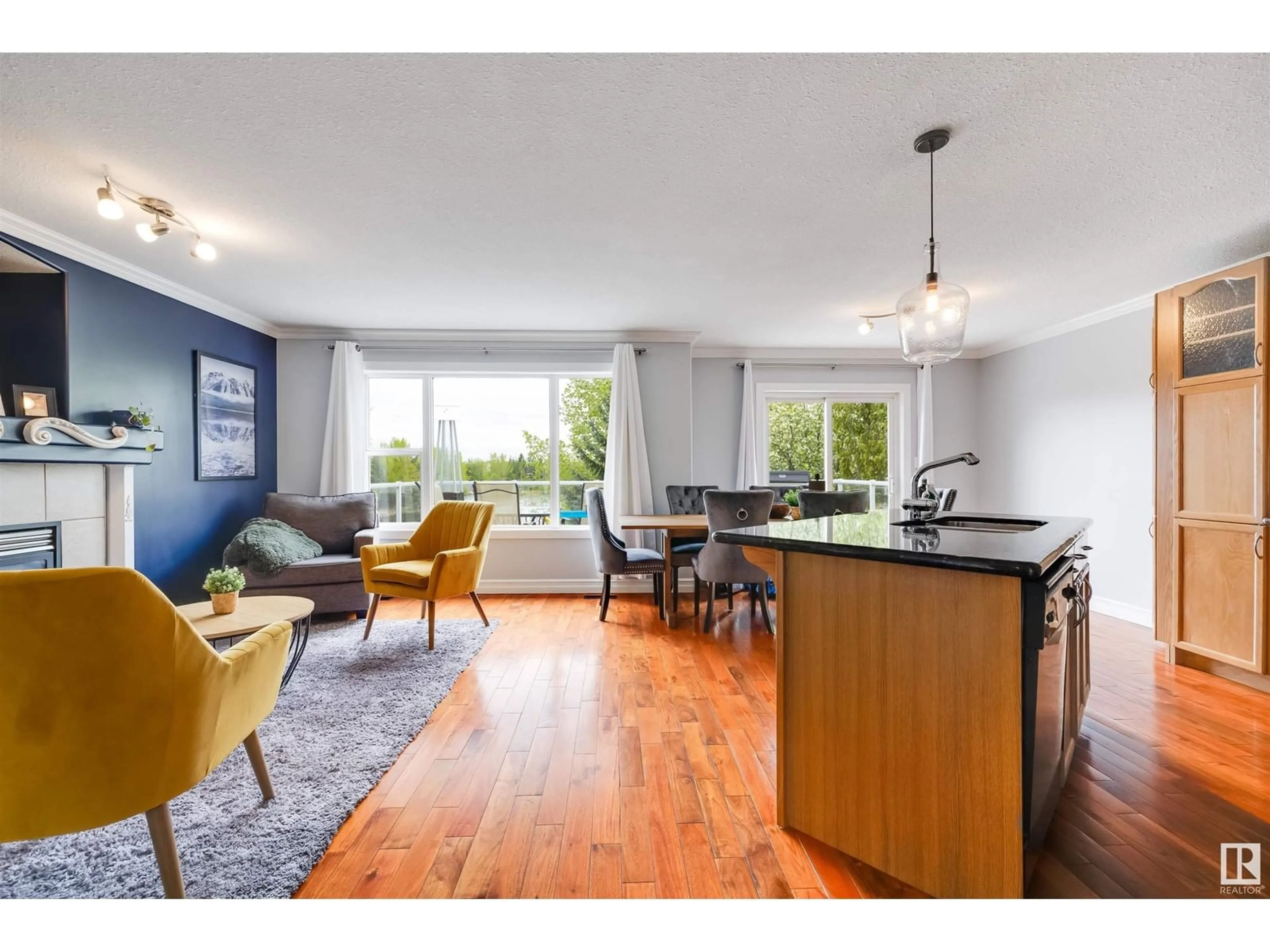 Open concept kitchen, wood/laminate floor for 11617 173A AV, Edmonton Alberta T5X6C5