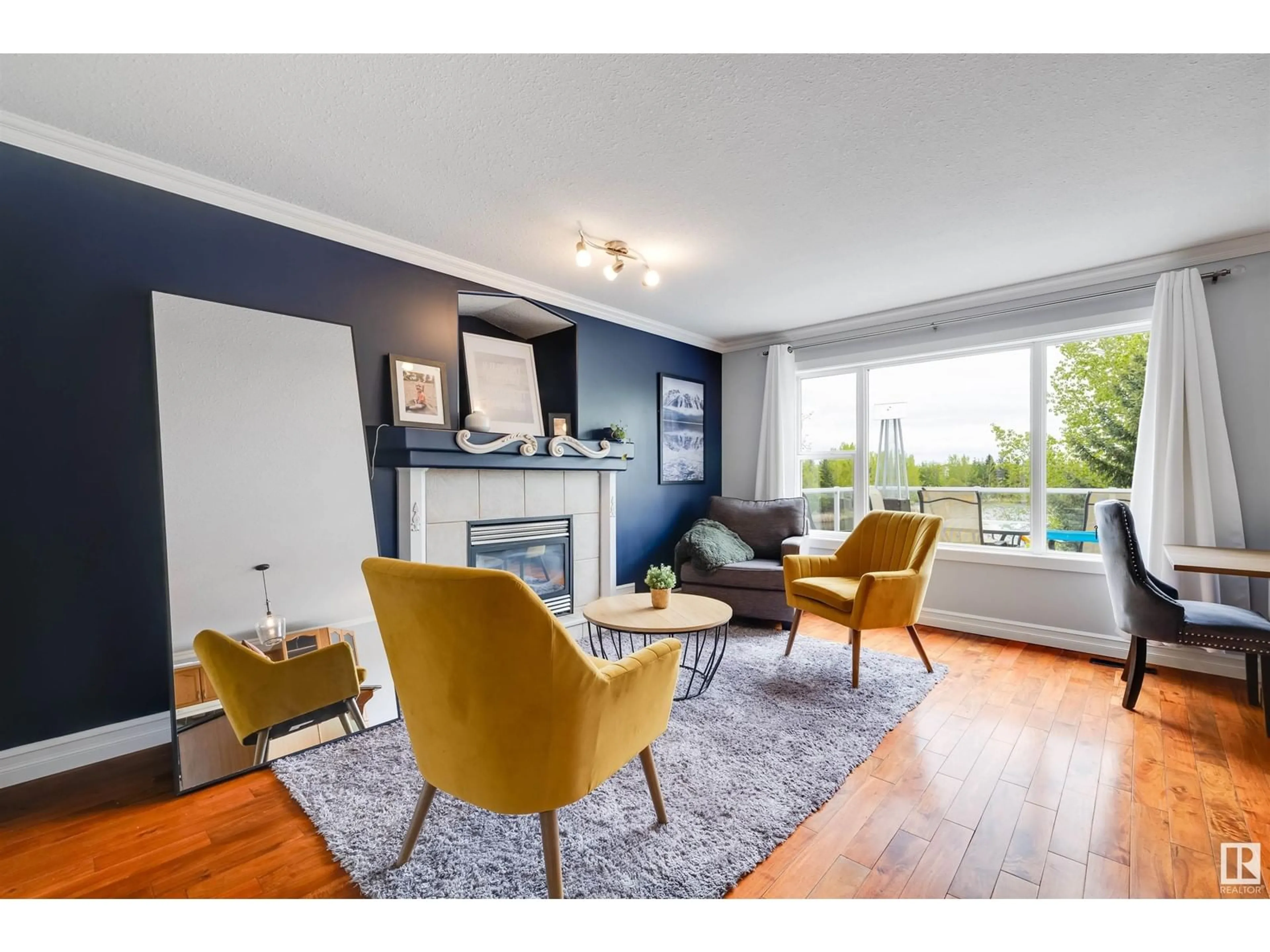 Living room with furniture, wood/laminate floor for 11617 173A AV, Edmonton Alberta T5X6C5