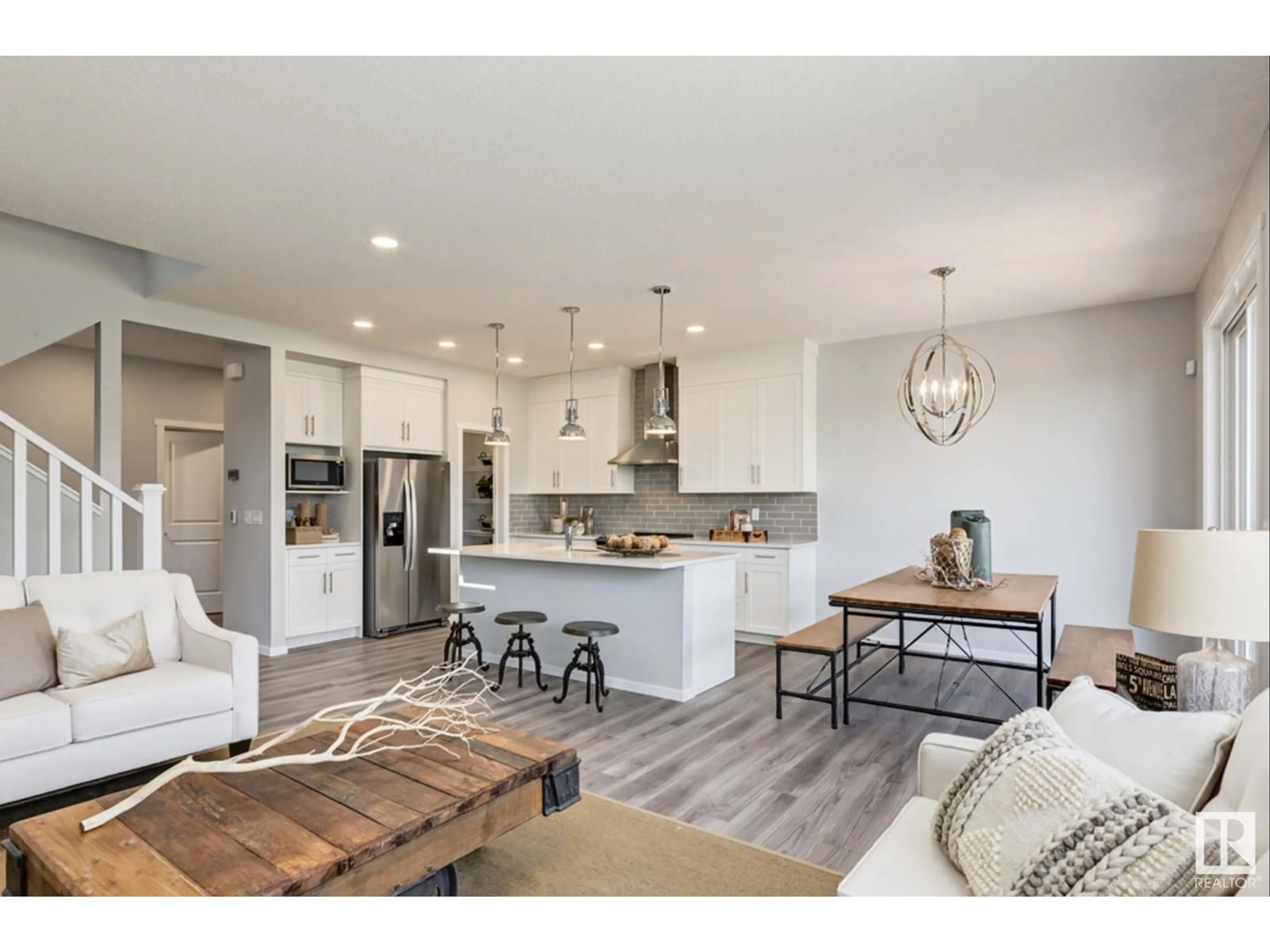 Open concept kitchen, wood/laminate floor for 2033 MUCKLEPLUM LINK, Edmonton Alberta T6X3H1
