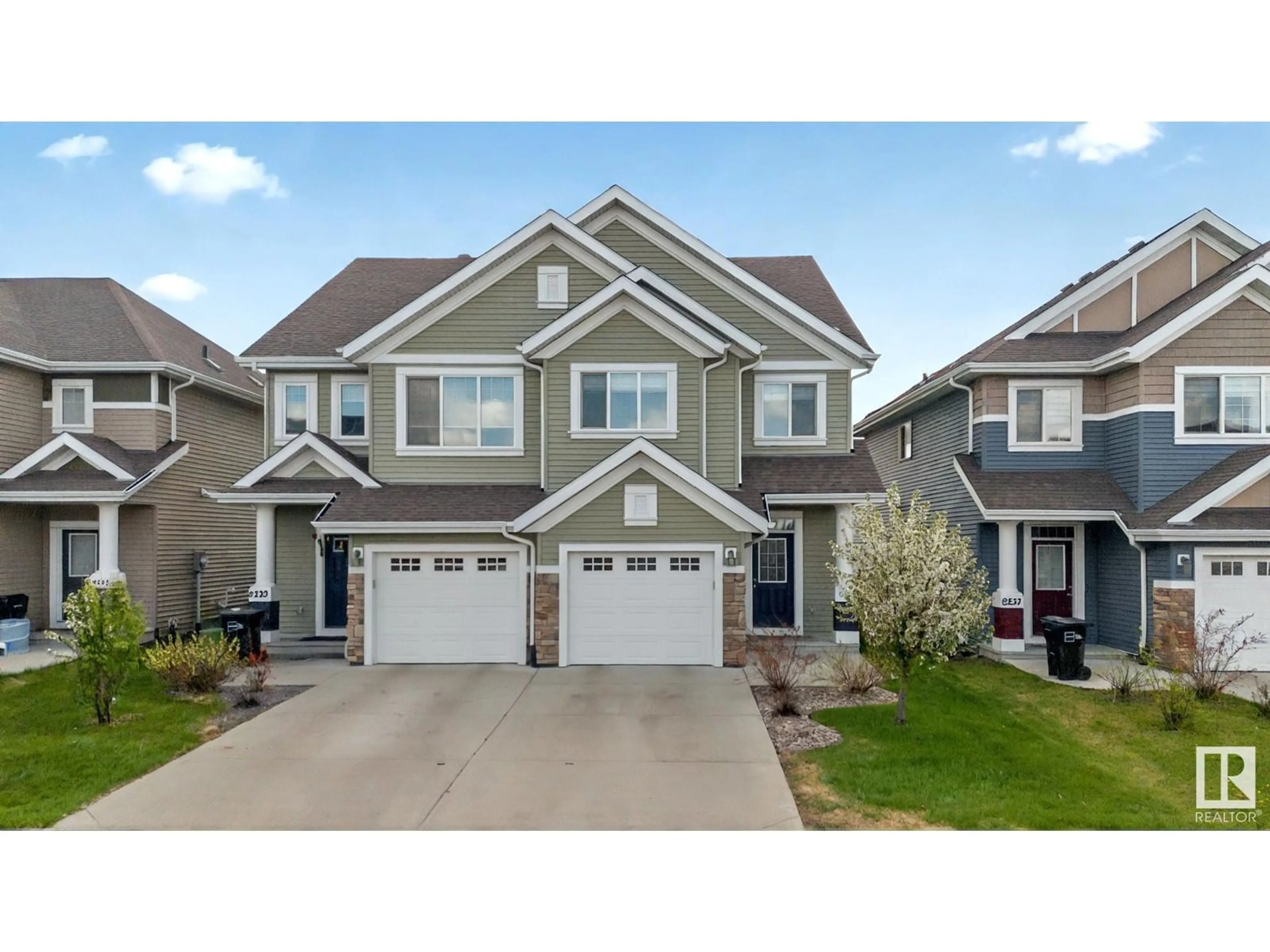 Home with vinyl exterior material, street for SW - 8233 24 AV, Edmonton Alberta T6X2J7
