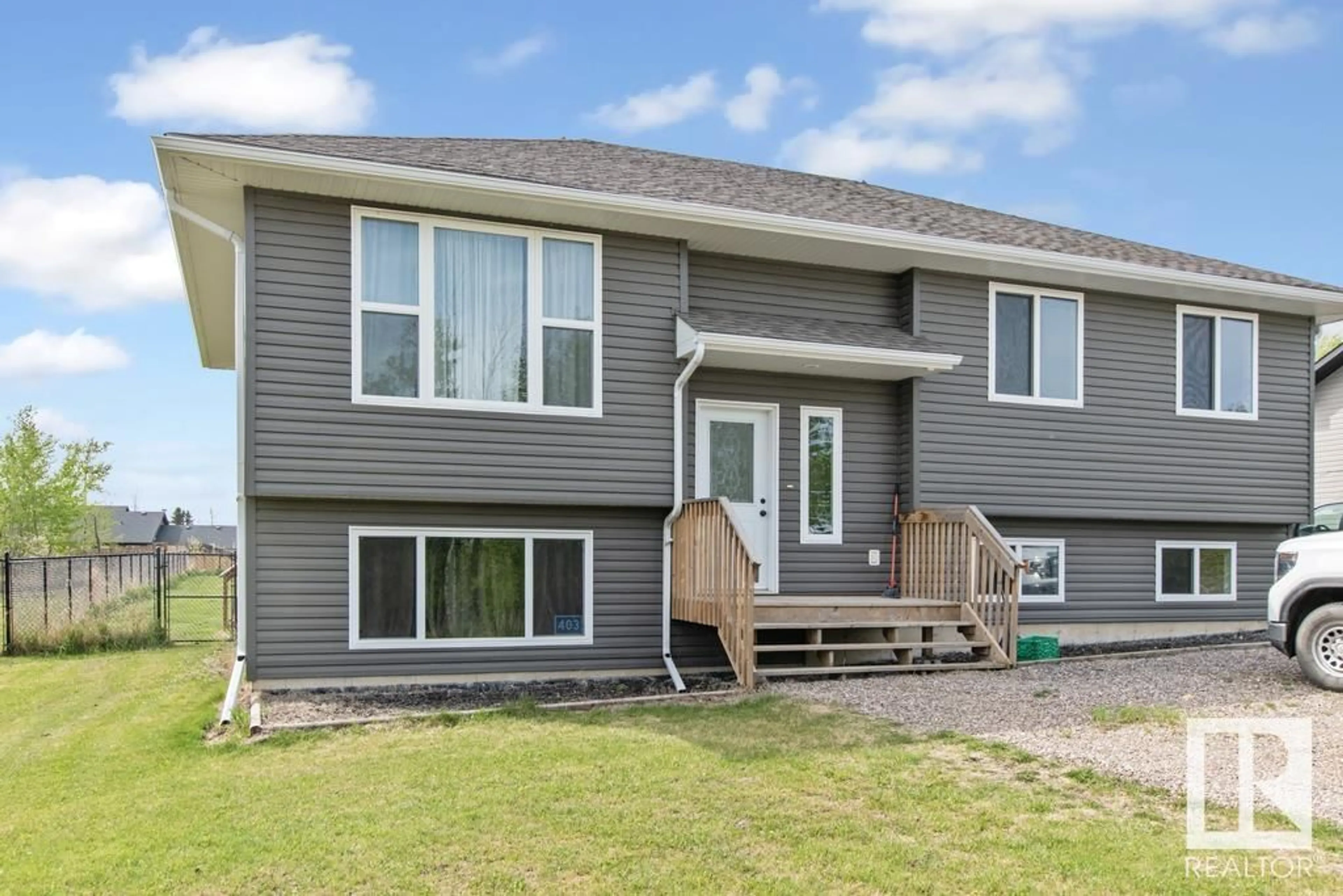Home with vinyl exterior material, street for 403 46410 TWP RD ROAD, Rural Bonnyville M.D. Alberta T9N2J6