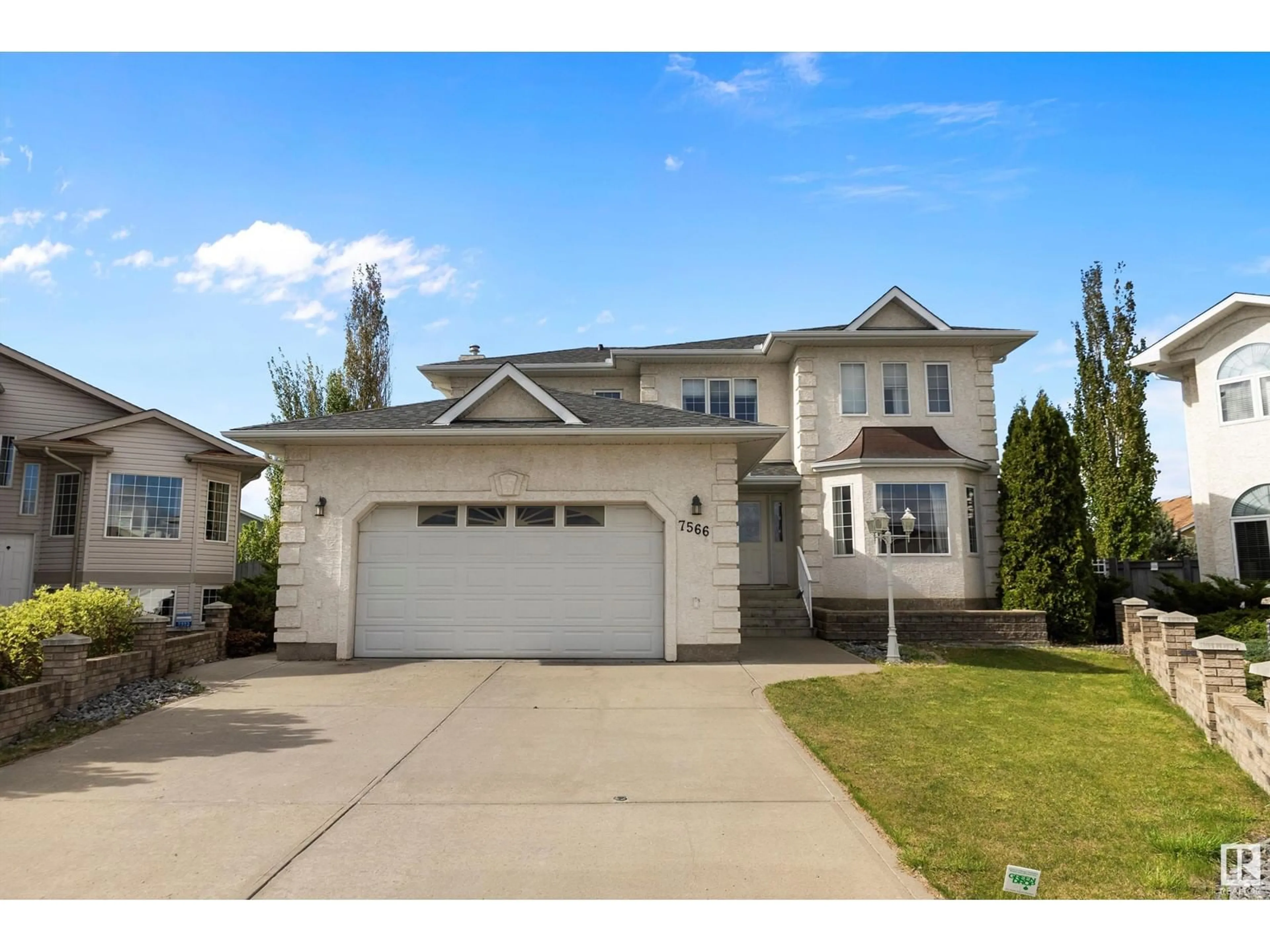 Home with vinyl exterior material, street for 7566 165A AV, Edmonton Alberta T5Z3P9