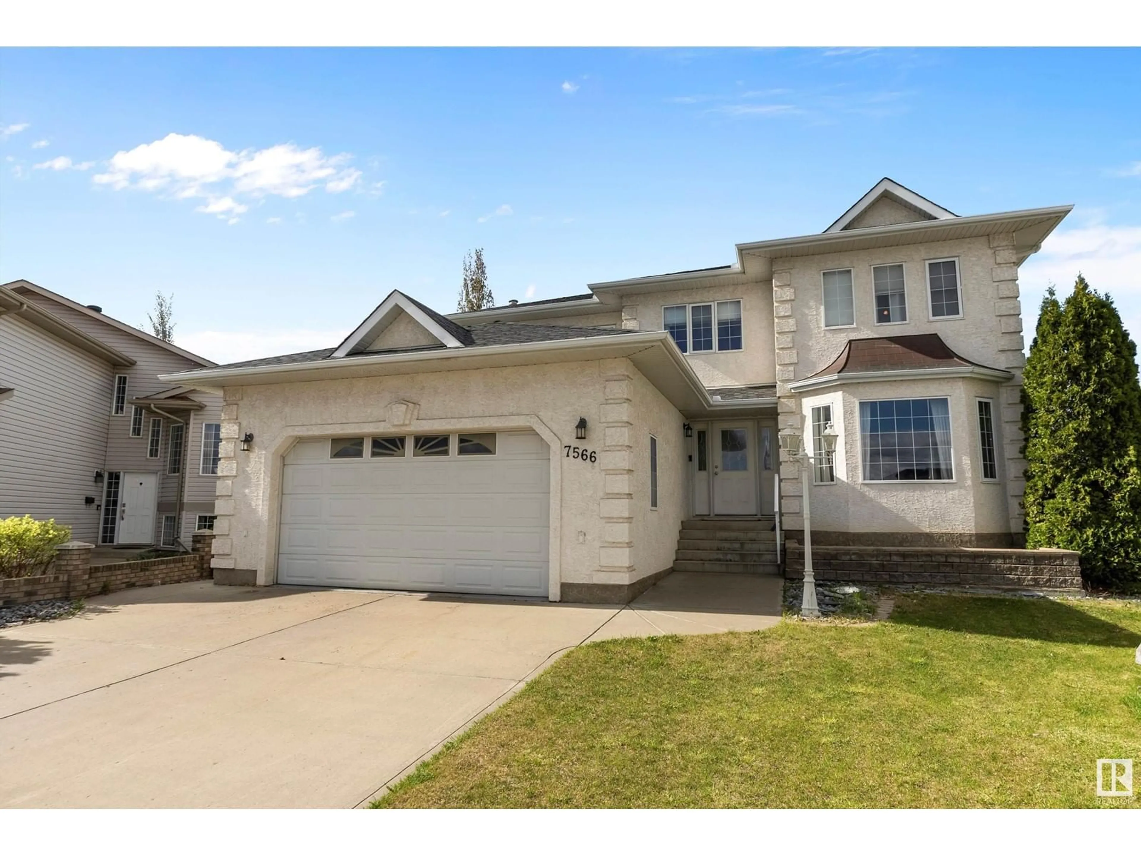 Home with vinyl exterior material, street for 7566 165A AV, Edmonton Alberta T5Z3P9