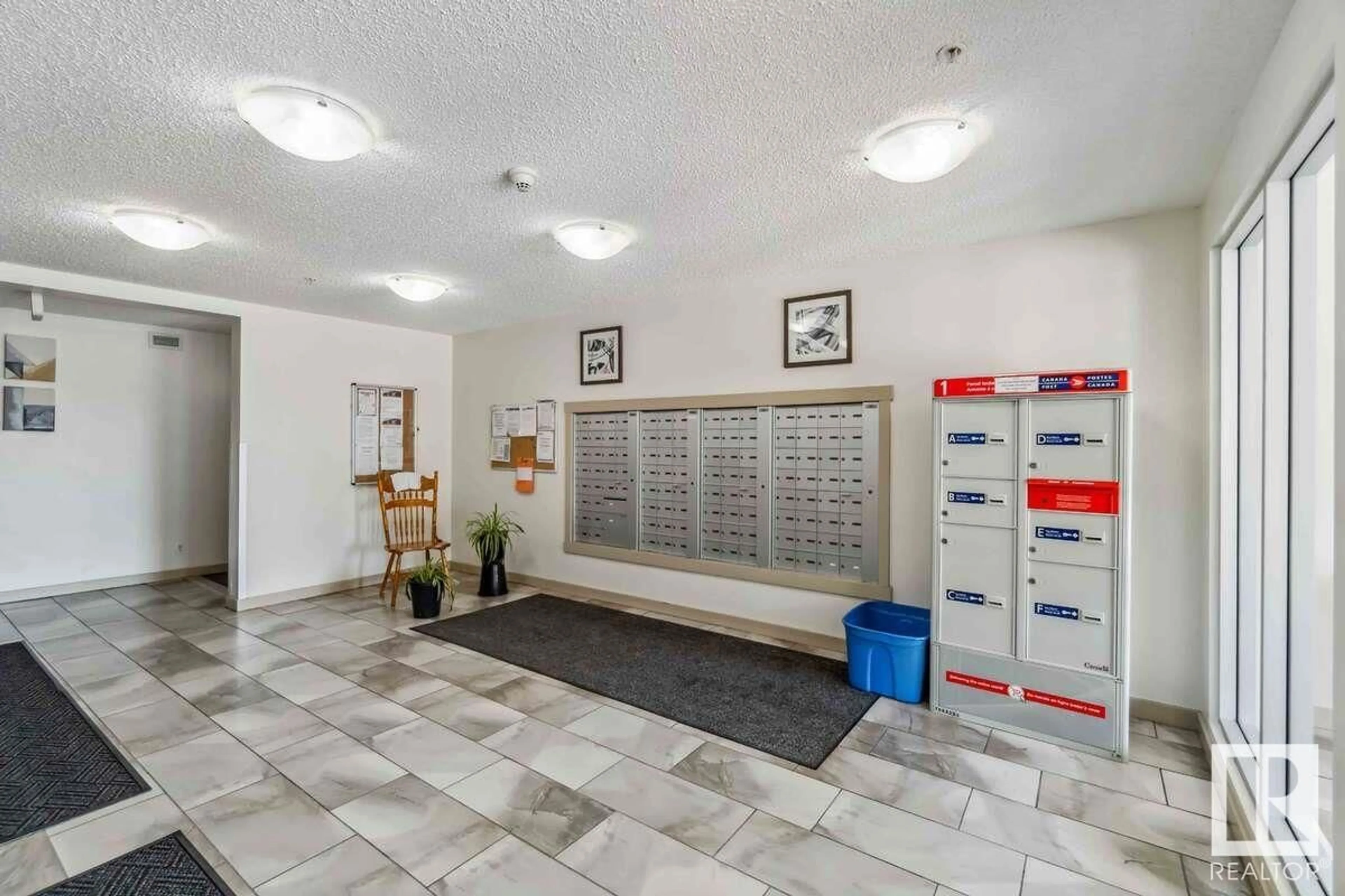 Indoor foyer for #112 - 5816 MULLEN PL, Edmonton Alberta T6R0W3