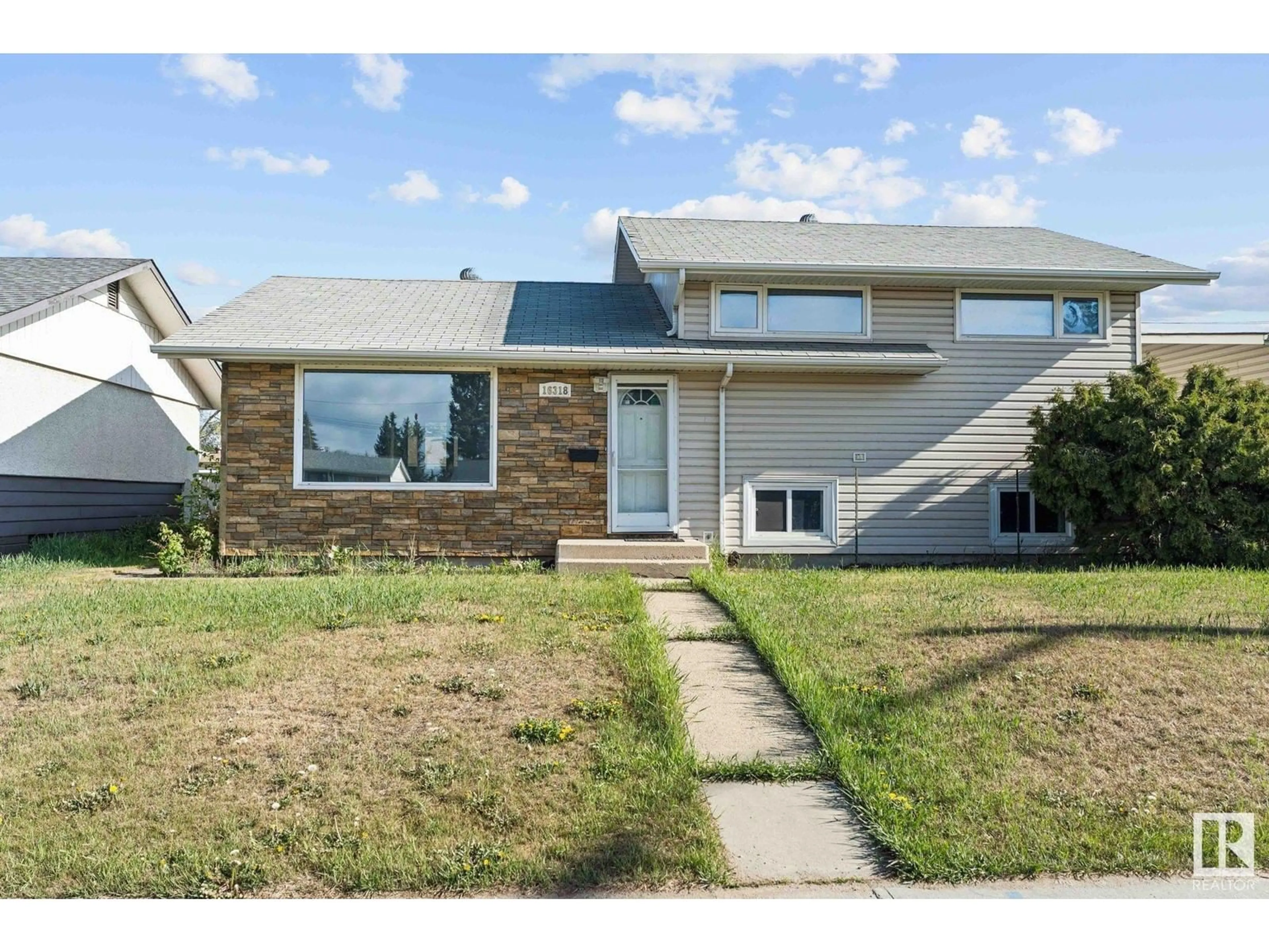 Home with vinyl exterior material, street for NW - 16318 87 AV, Edmonton Alberta T5R4H2