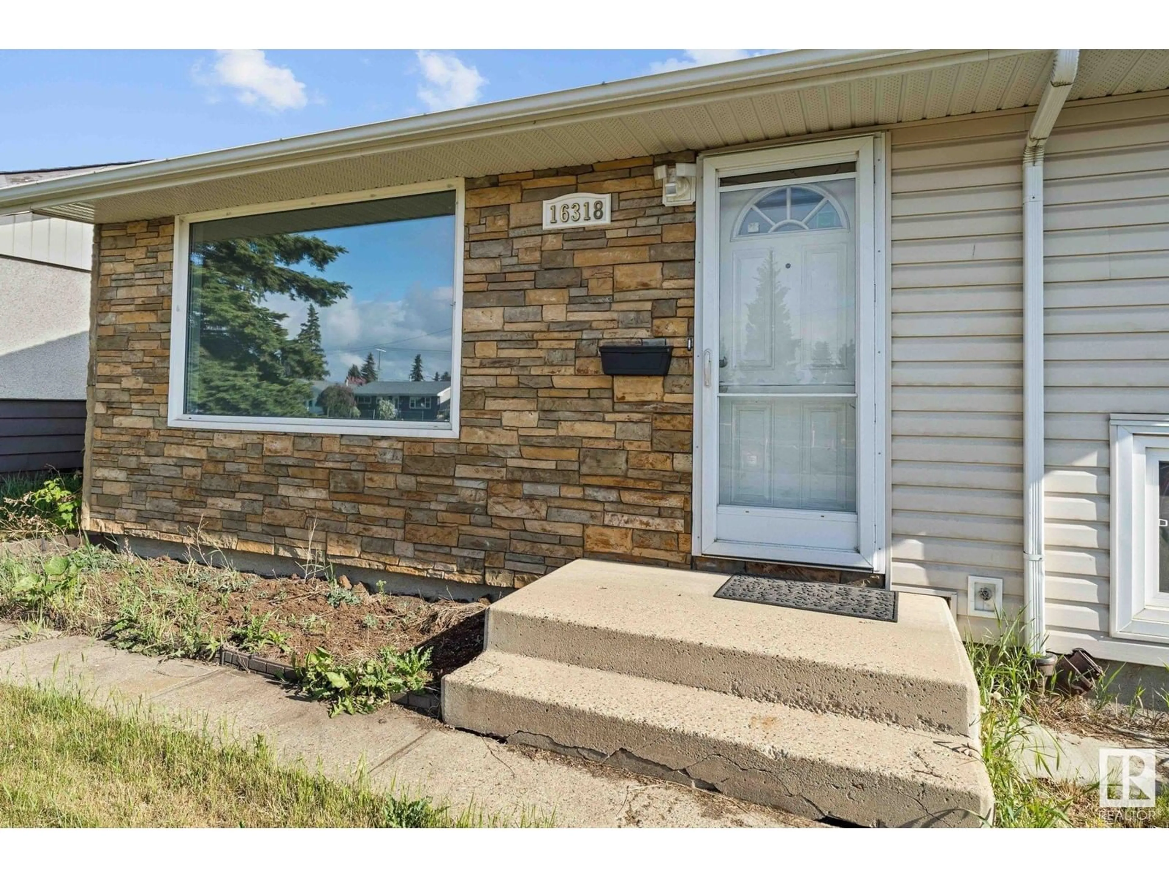 Home with brick exterior material, street for NW - 16318 87 AV, Edmonton Alberta T5R4H2