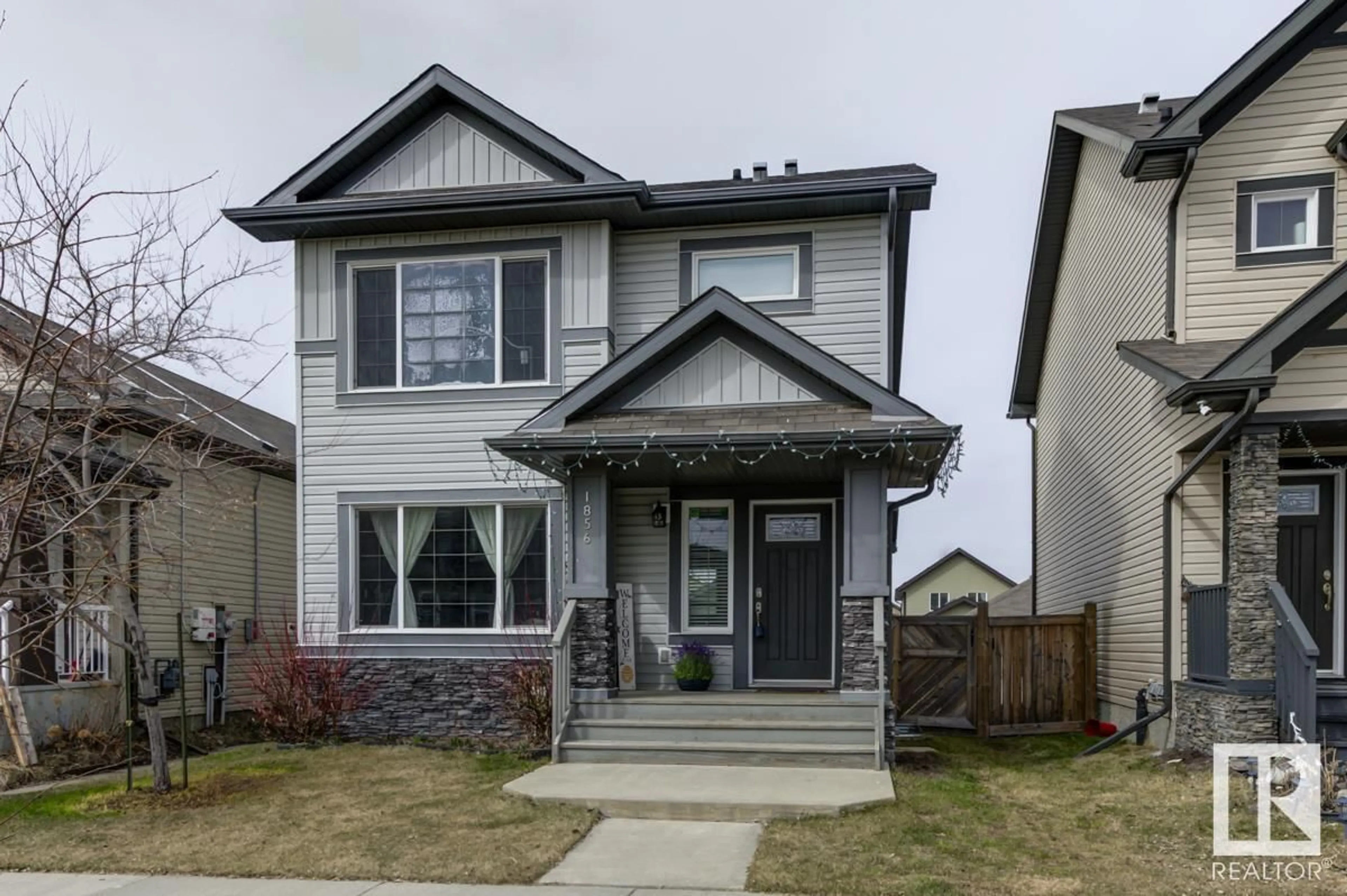 Home with vinyl exterior material, street for 1856 30 ST NW, Edmonton Alberta T6T0N6
