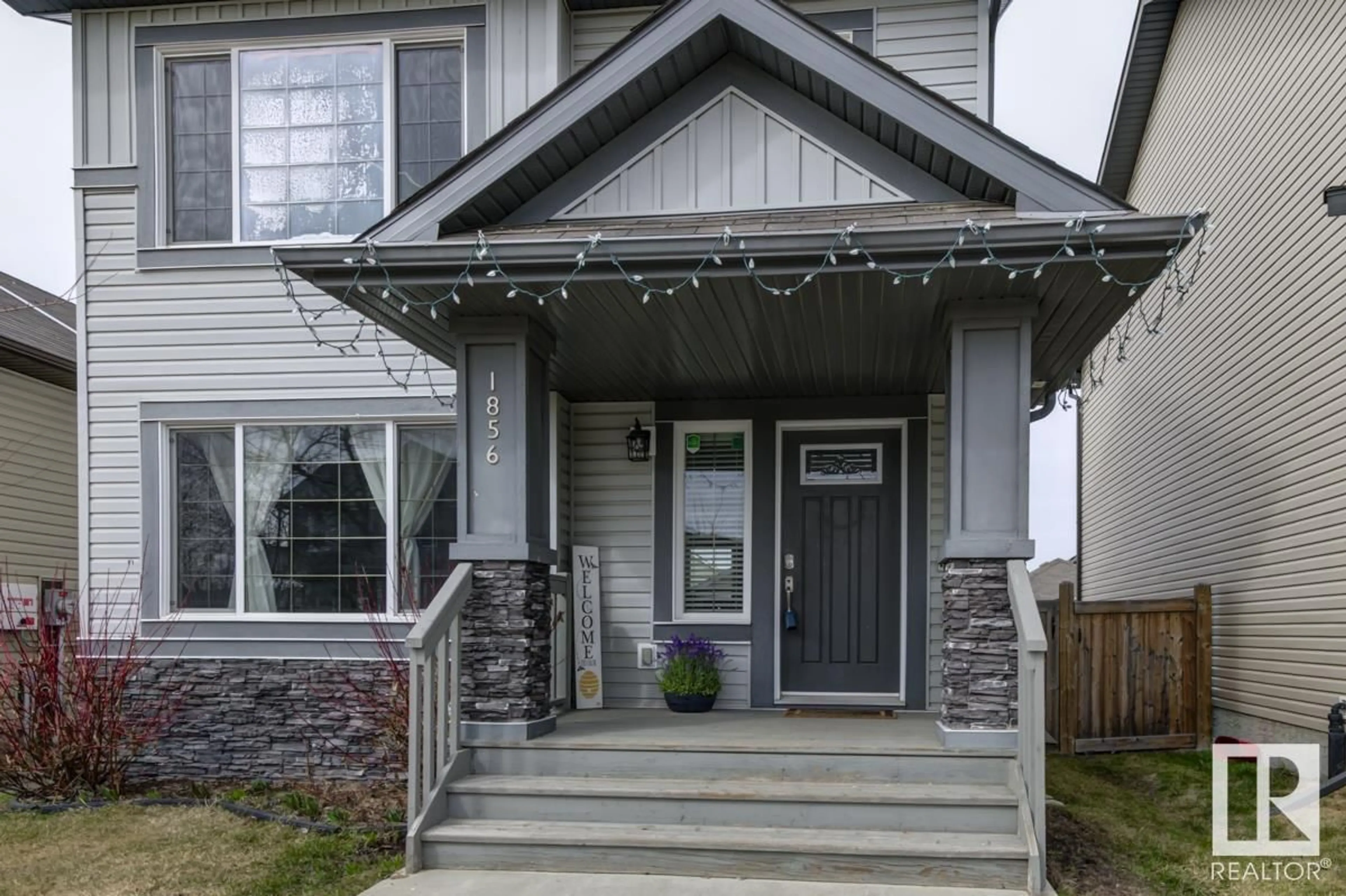 Home with vinyl exterior material, street for 1856 30 ST NW, Edmonton Alberta T6T0N6