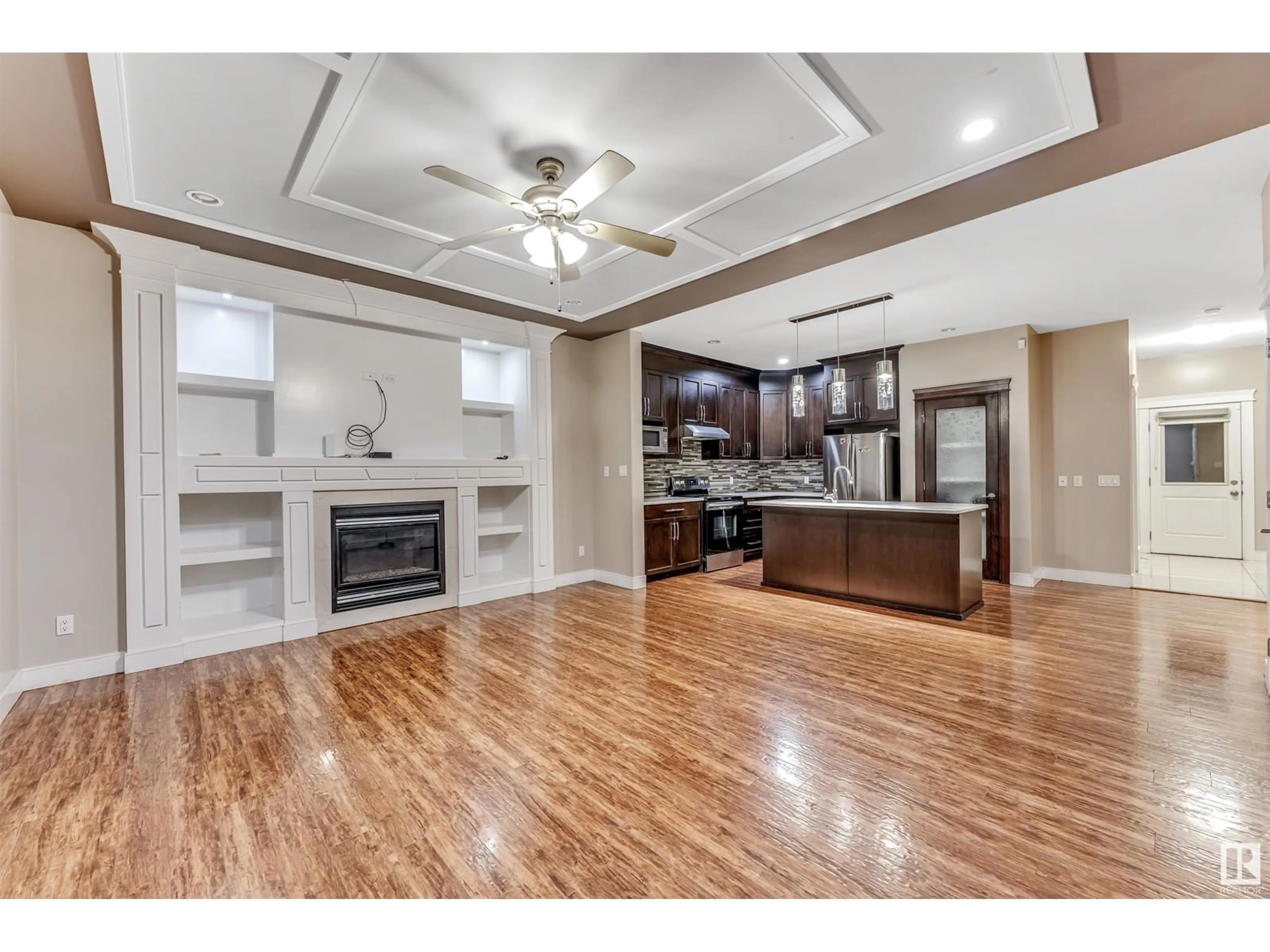 Open concept kitchen, wood/laminate floor for 2628 11 ST, Edmonton Alberta T6T0X9