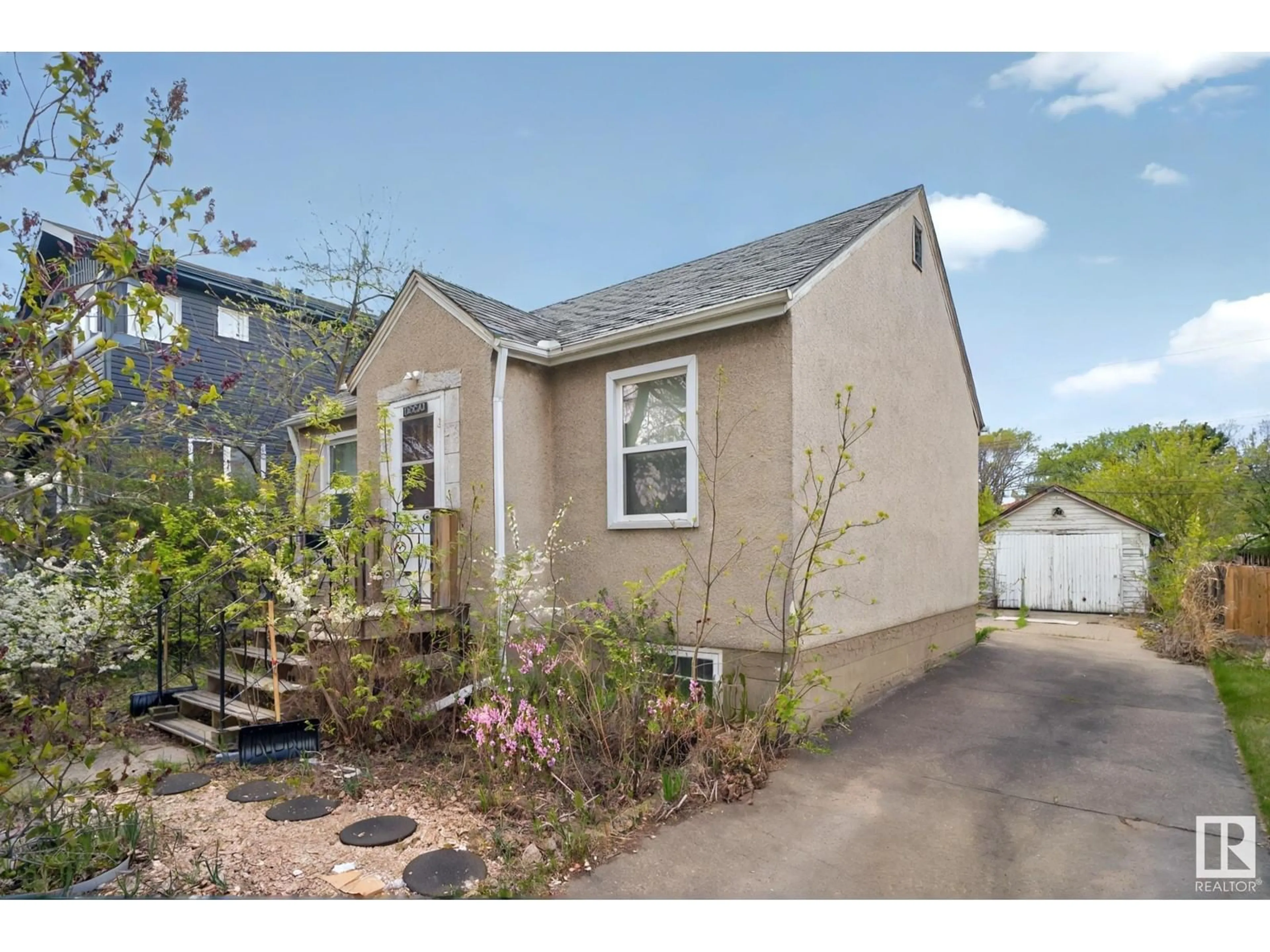 Home with vinyl exterior material, street for 12330 91 ST, Edmonton Alberta T5B4C5