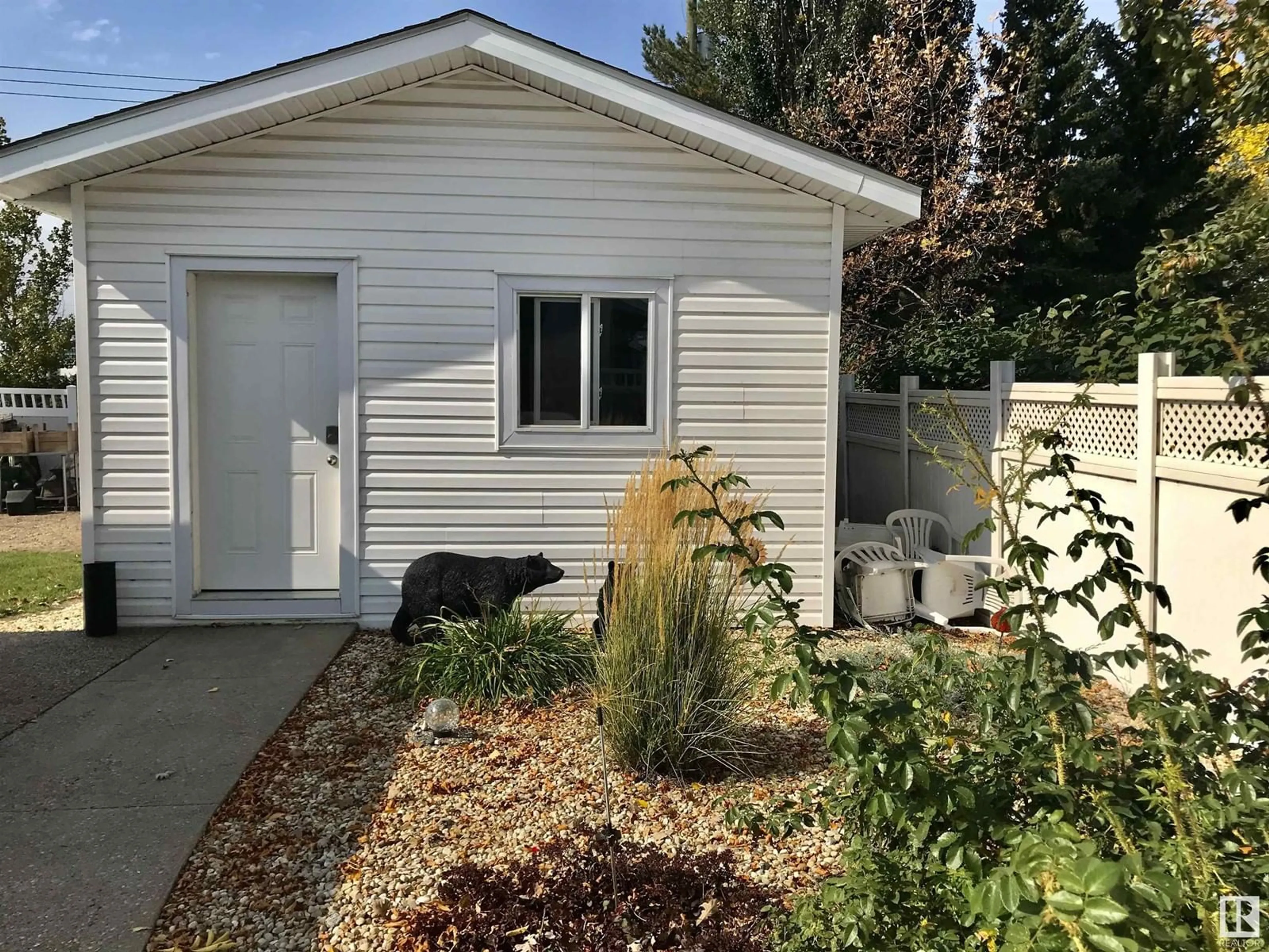 Home with vinyl exterior material, street for 5806 57 ST, Vegreville Alberta T9C1J1