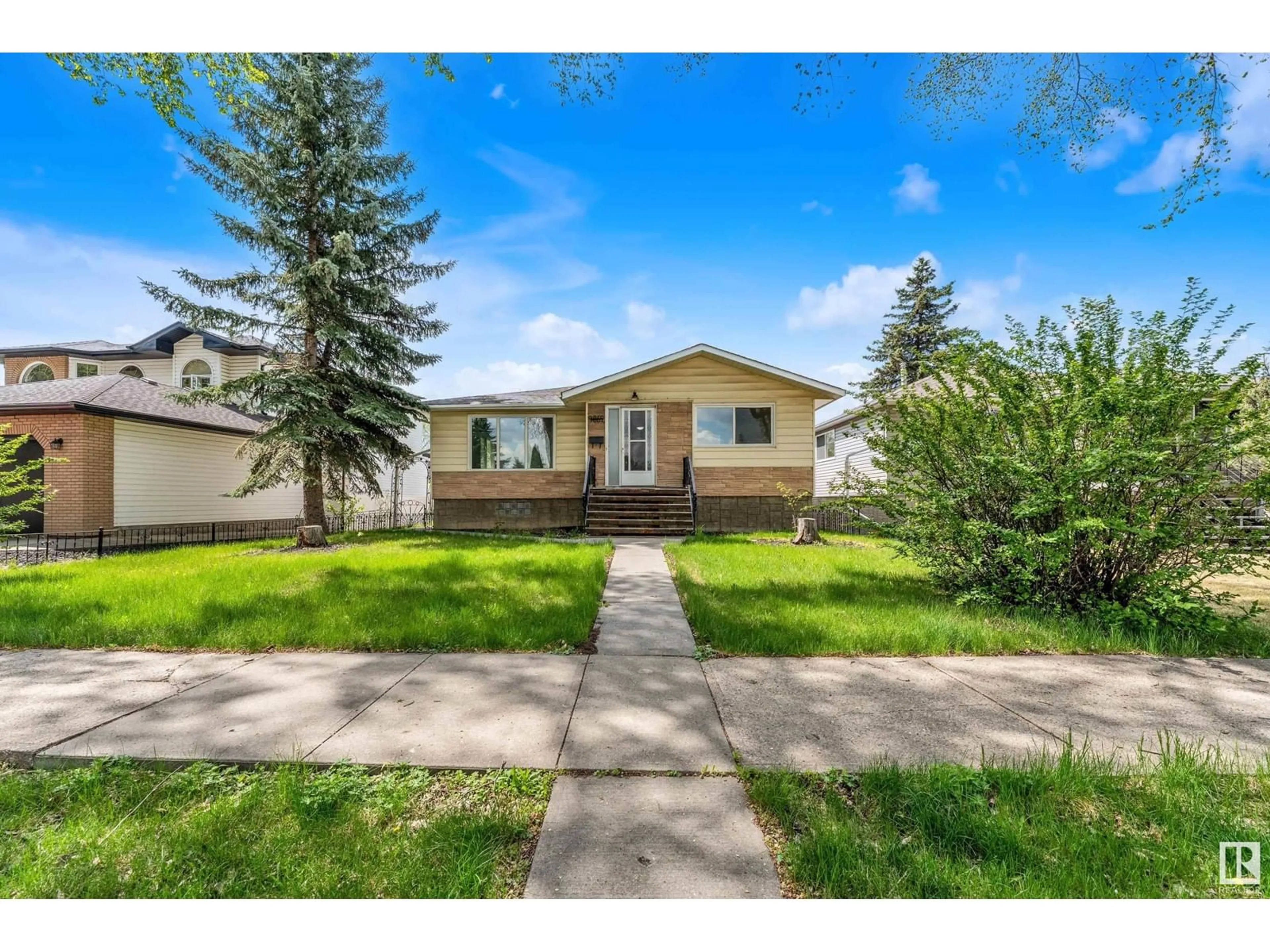 Home with vinyl exterior material, street for NW - 9852 76 ST, Edmonton Alberta T6A3A2