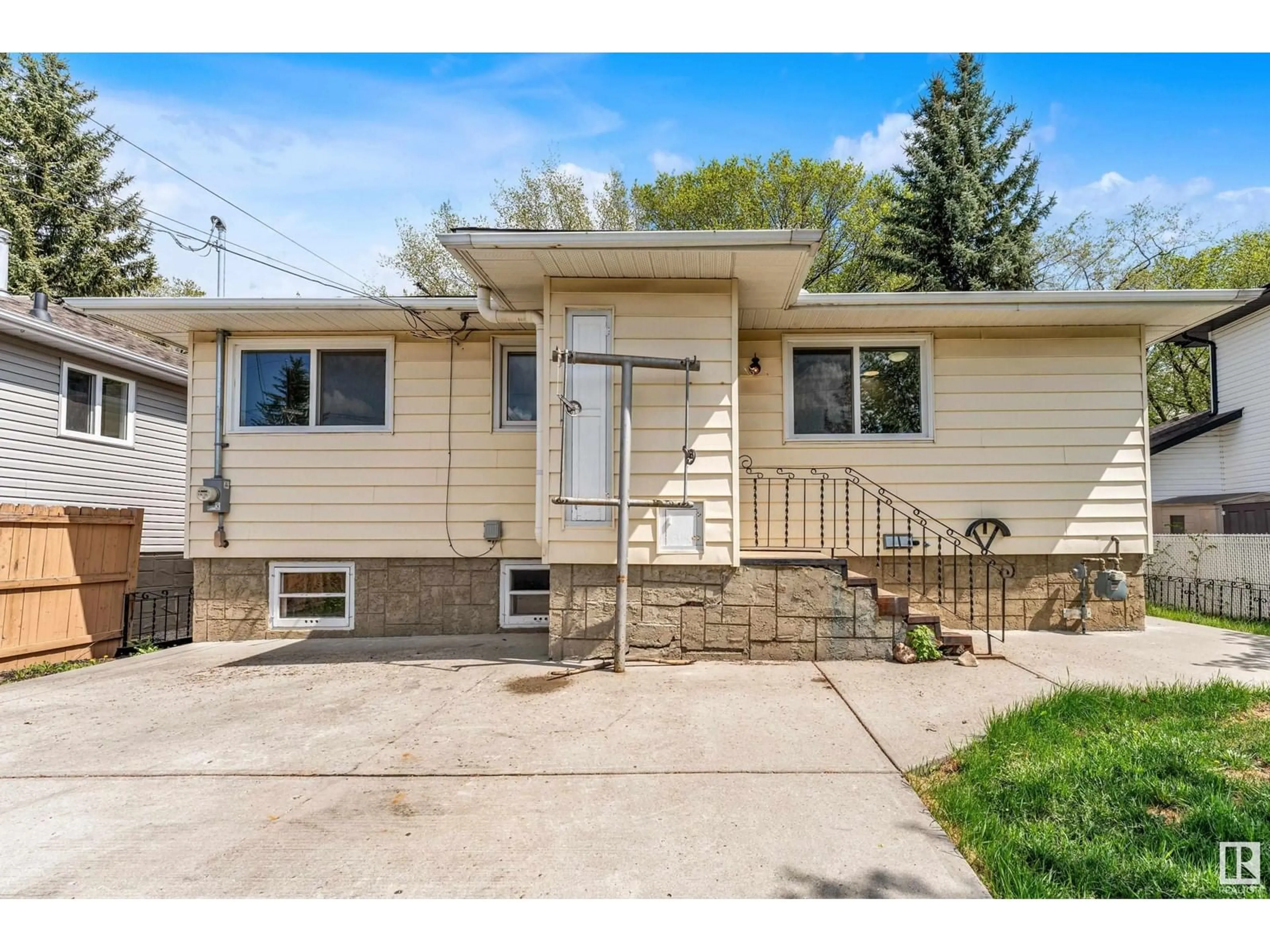 Home with vinyl exterior material, street for NW - 9852 76 ST, Edmonton Alberta T6A3A2