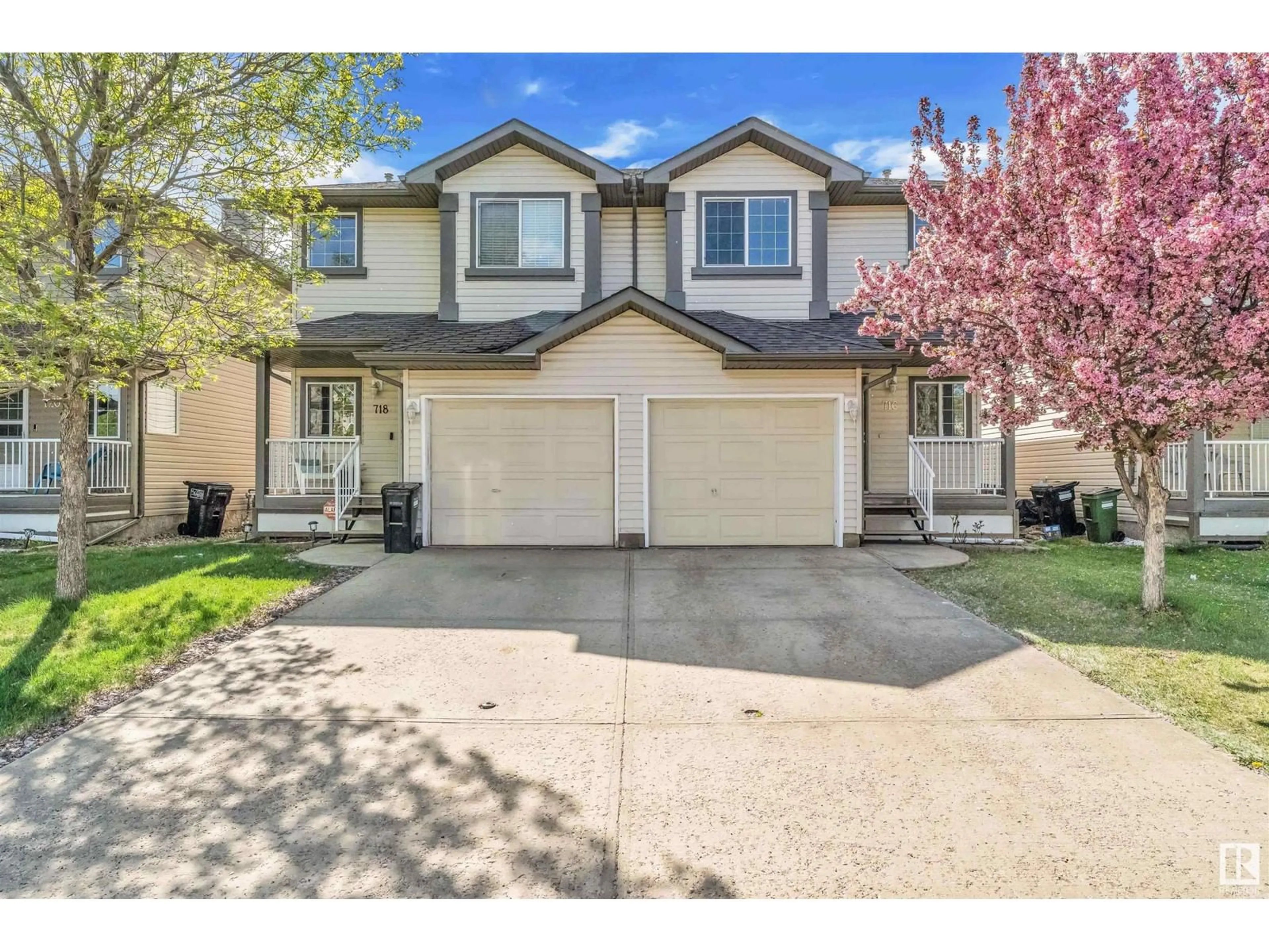 Home with vinyl exterior material, street for 716 83 ST, Edmonton Alberta T6X1L7