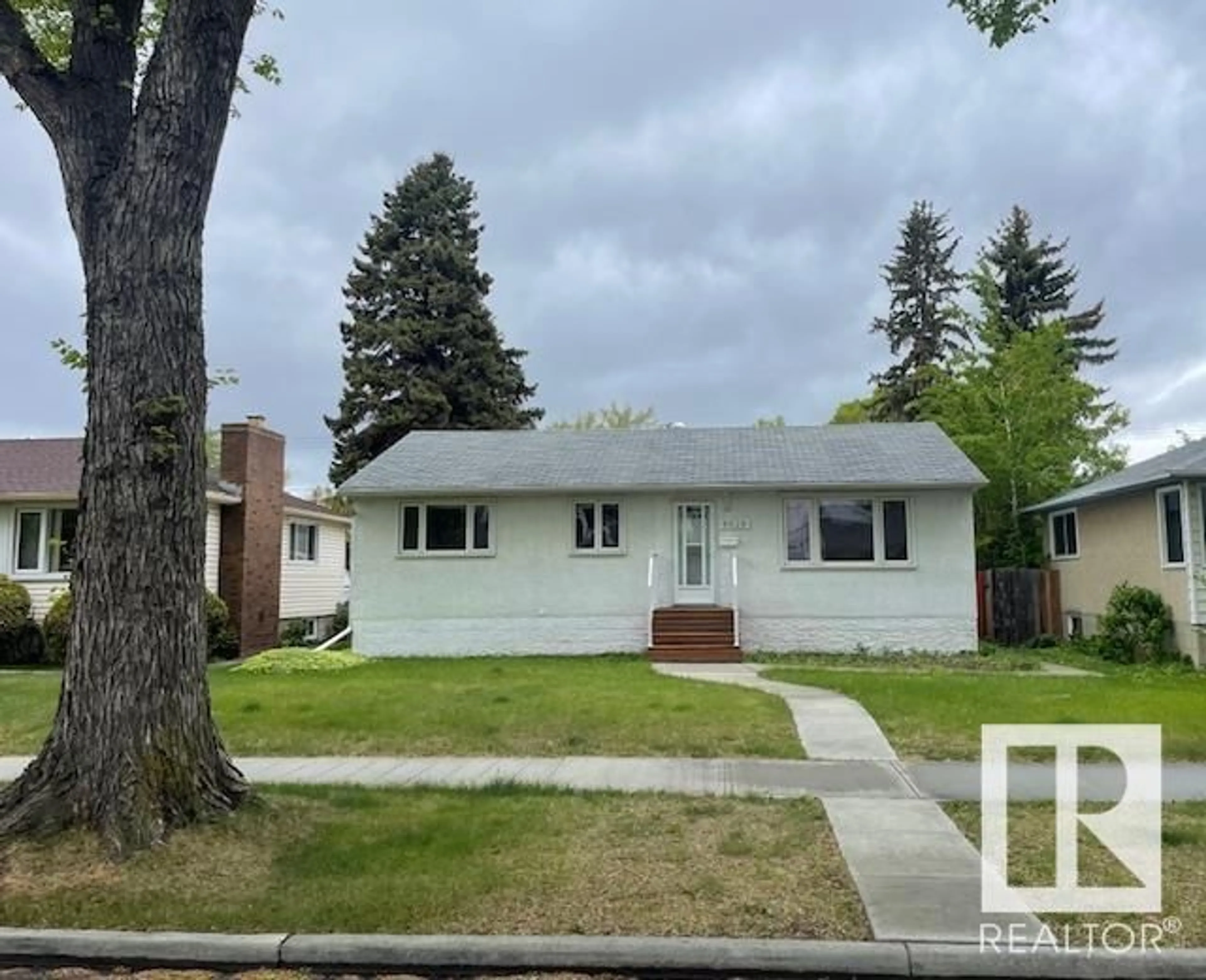 Home with vinyl exterior material, street for NW - 8528 64 AV, Edmonton Alberta T6E0H3