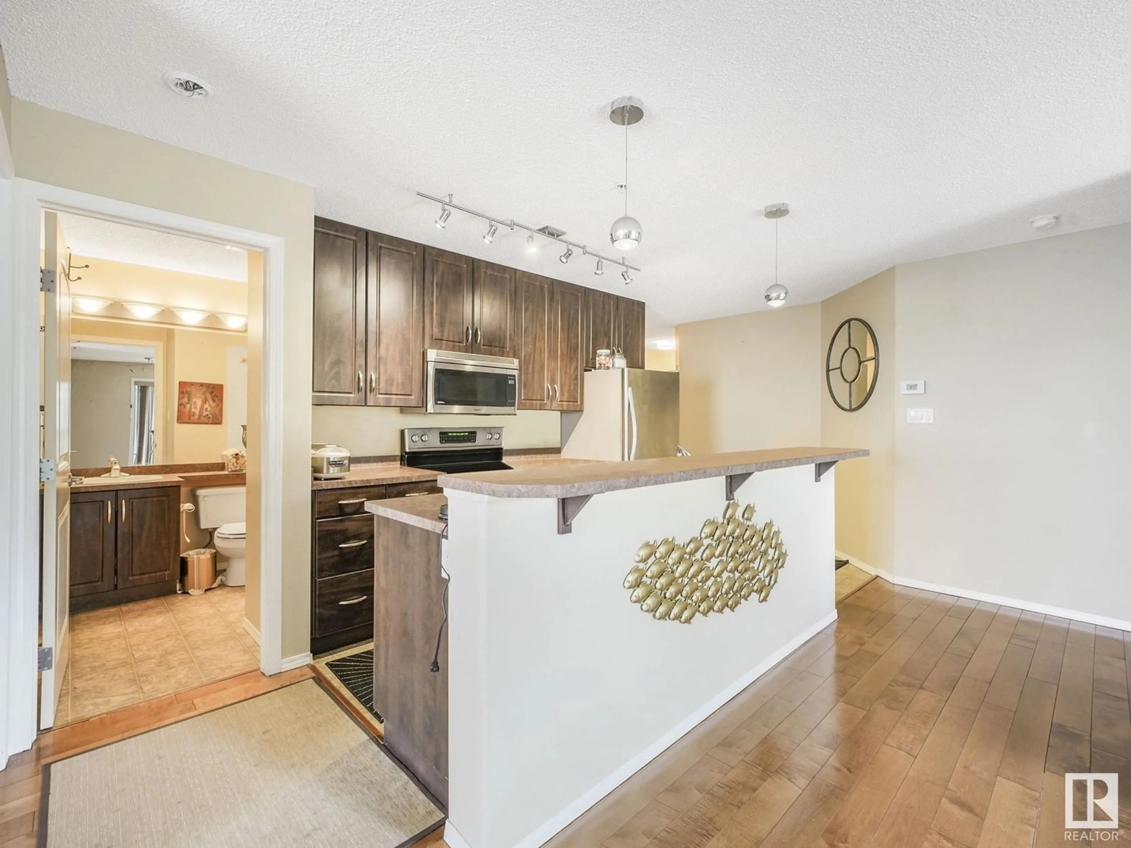 Open concept kitchen, wood/laminate floor for #302 - 17407 99 AV, Edmonton Alberta T5T0W7