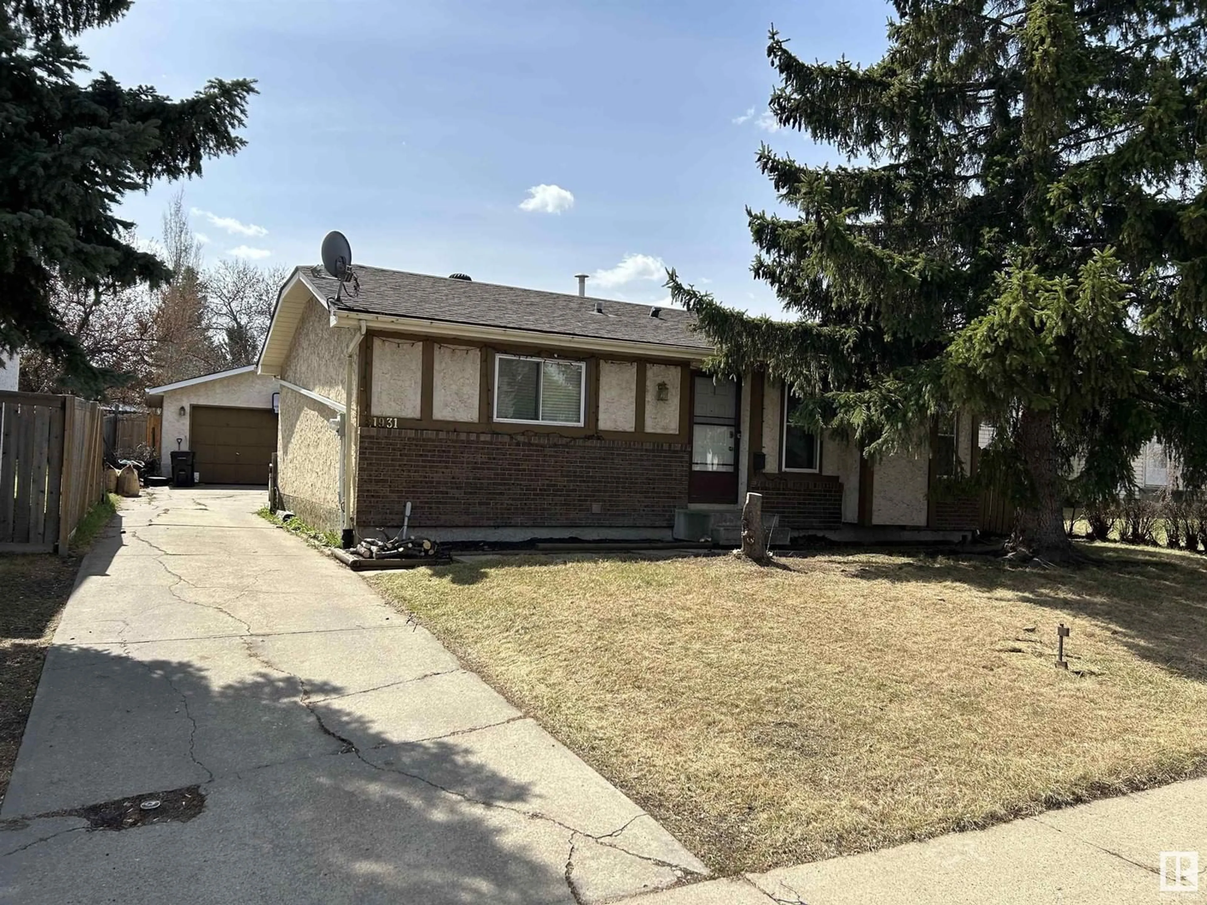 Home with vinyl exterior material, street for 1931 145A AV, Edmonton Alberta T5Y1S9