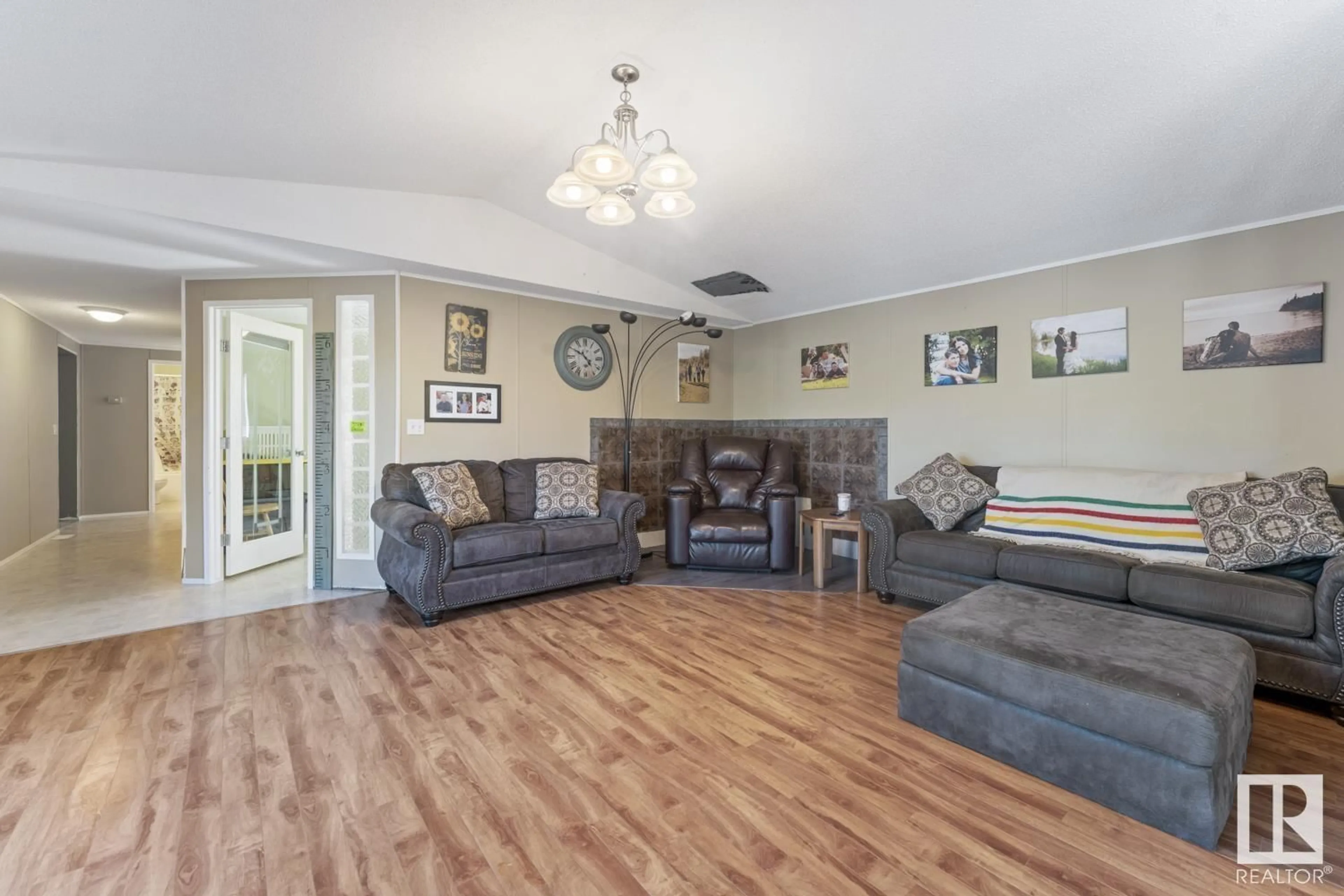 Living room with furniture, wood/laminate floor for 60313 657 HI, Rural Bonnyville M.D. Alberta T9N2J6