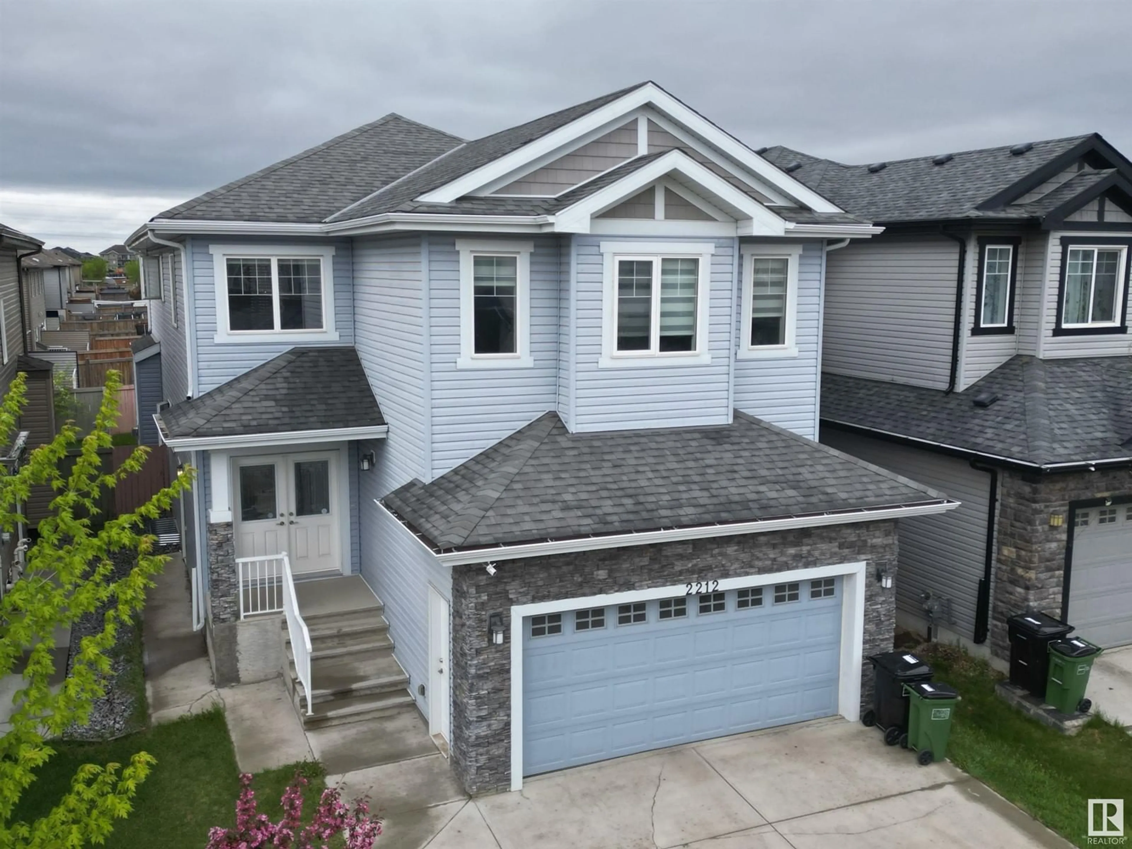 A pic from outside/outdoor area/front of a property/back of a property/a pic from drone, street for 2212 22 ST, Edmonton Alberta T6T0Z1
