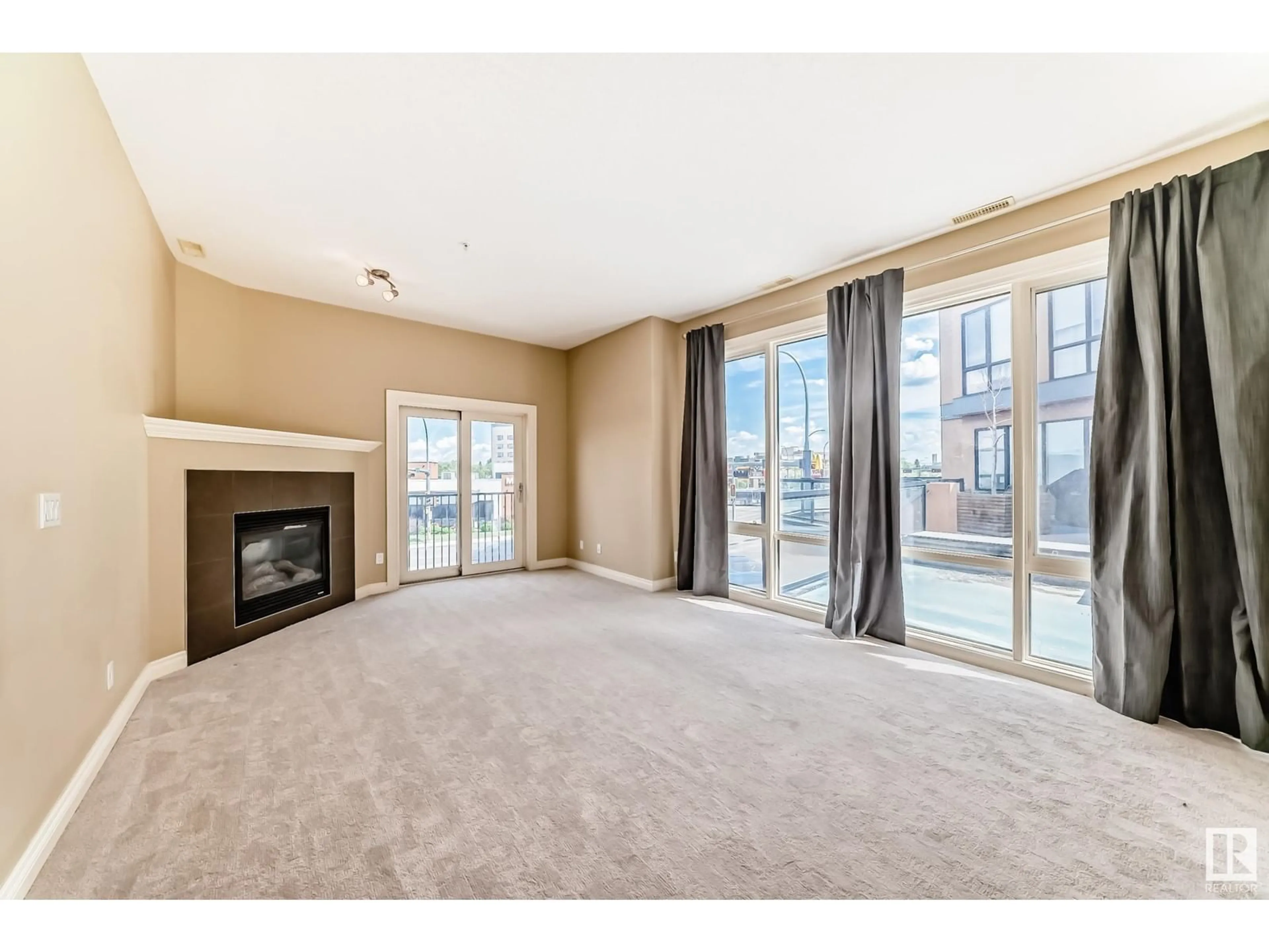 Living room with furniture, carpet floor for #209 - 10625 KINGSWAY AV, Edmonton Alberta T5G2Z6