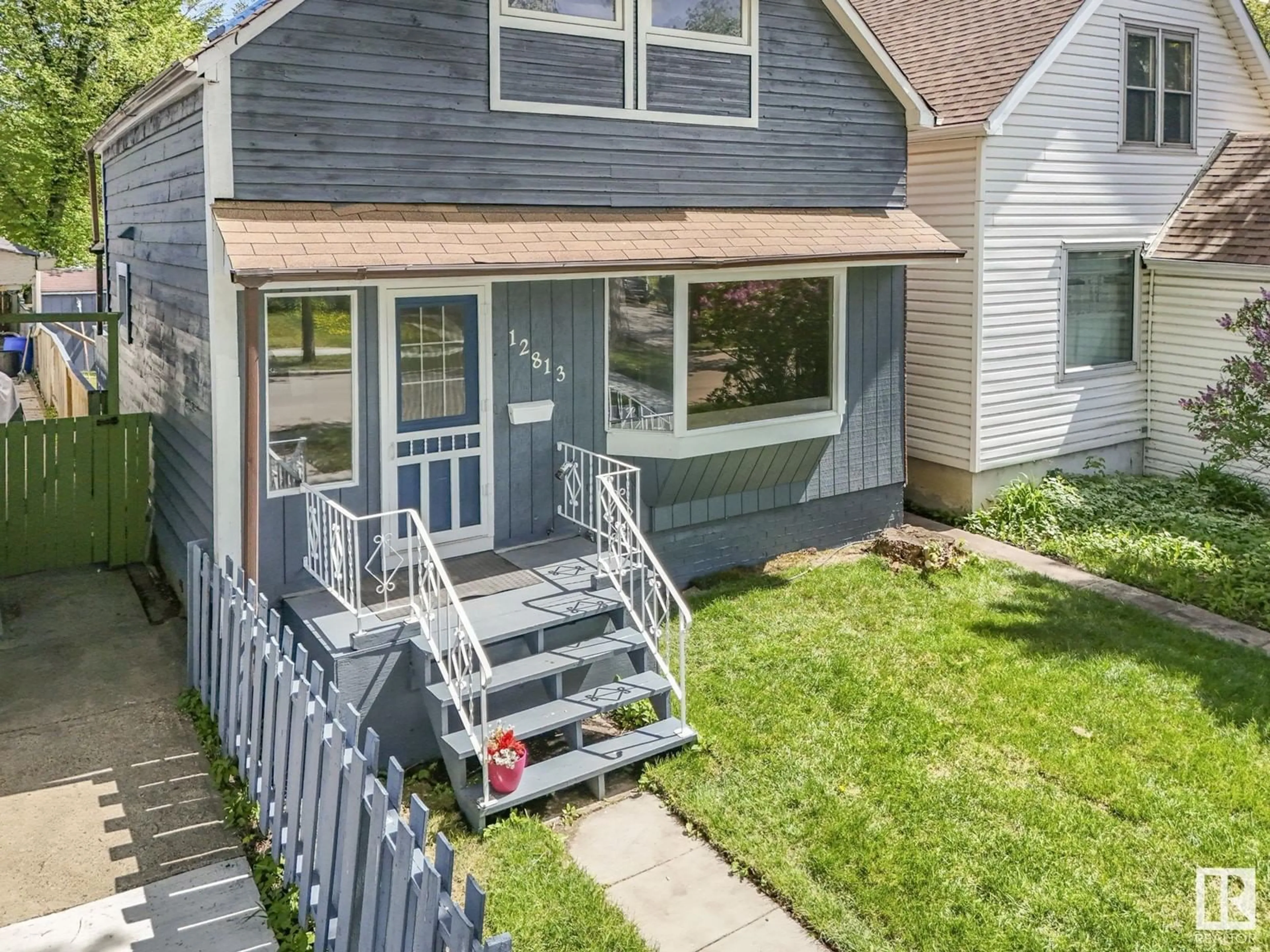 Home with vinyl exterior material, street for NW - 12813 121 ST, Edmonton Alberta T5L0B1