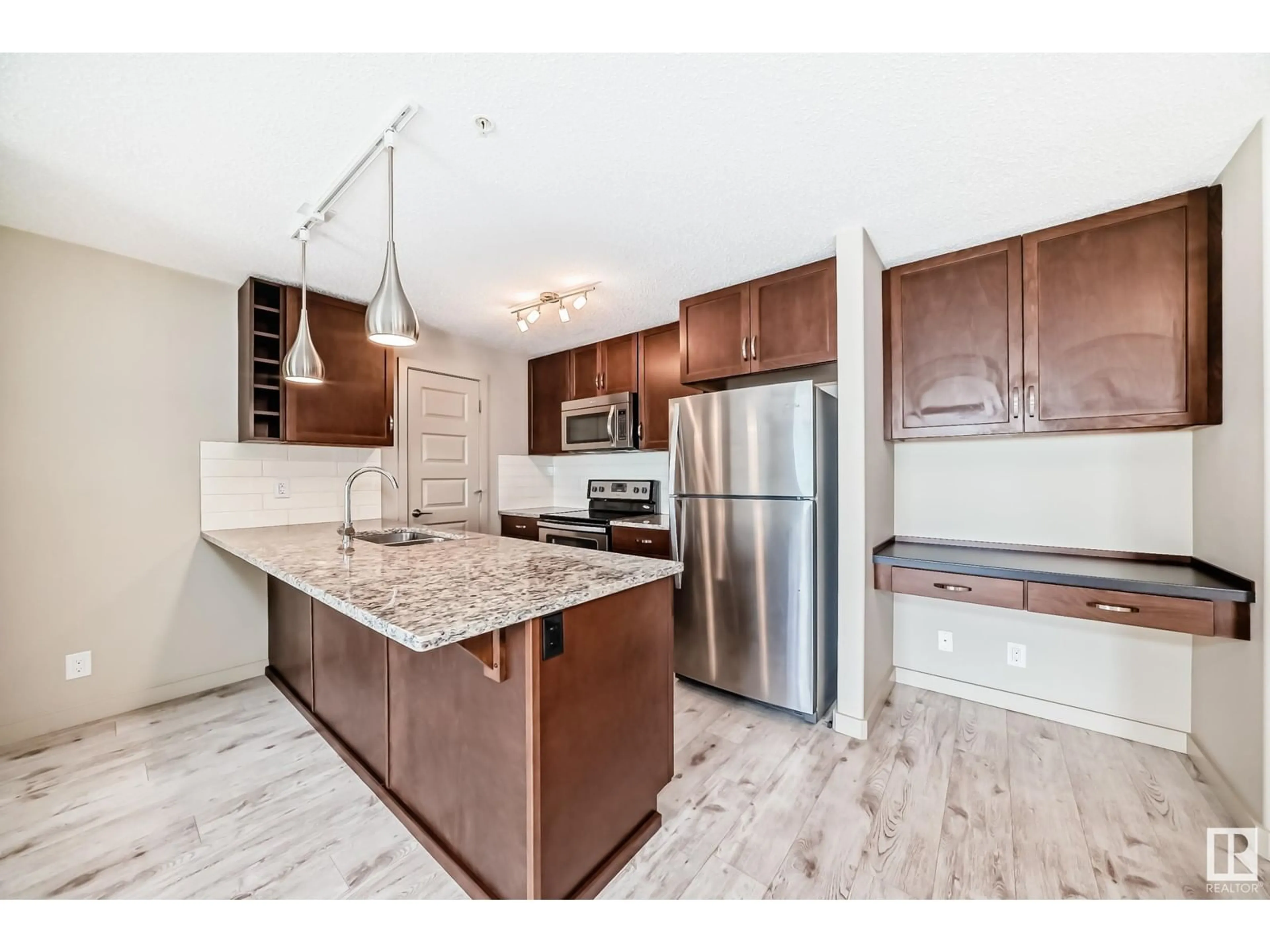 Open concept kitchen, ceramic/tile floor for #318 - 4008 SAVARYN DR, Edmonton Alberta T6X2E5