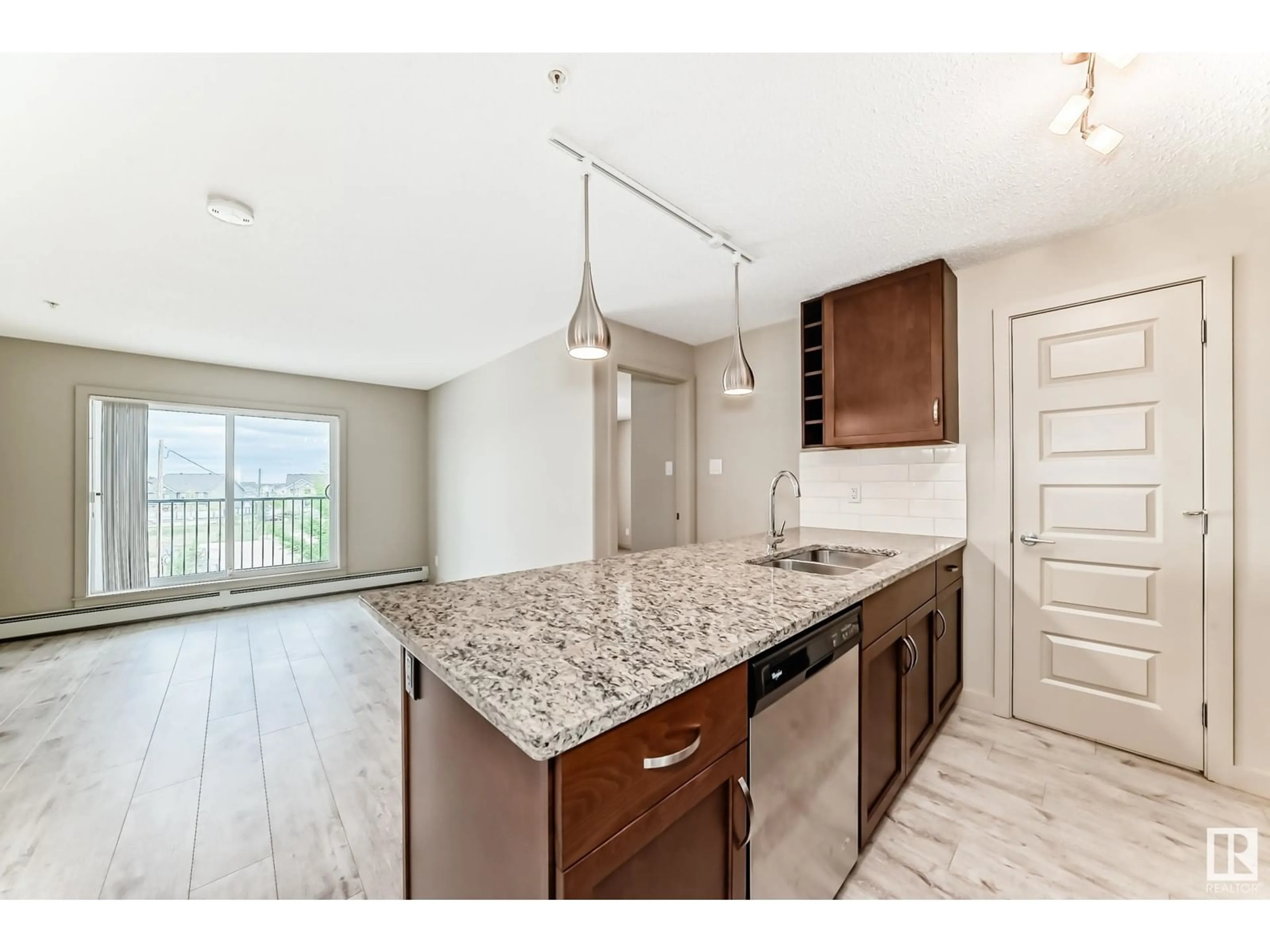Open concept kitchen, unknown for #318 - 4008 SAVARYN DR, Edmonton Alberta T6X2E5
