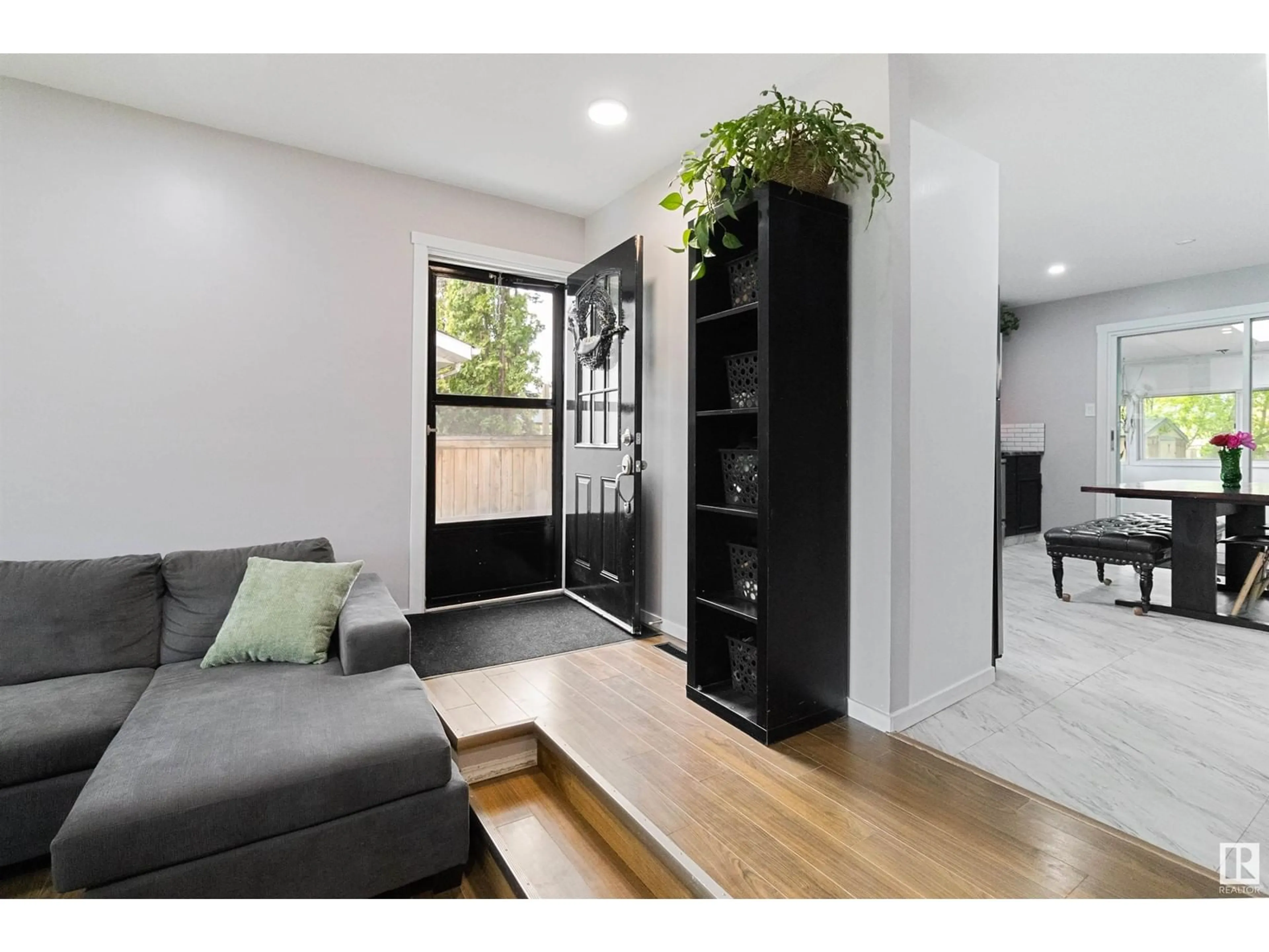 Living room with furniture, wood/laminate floor for 4748 56 AVE, Tofield Alberta T0B4J0